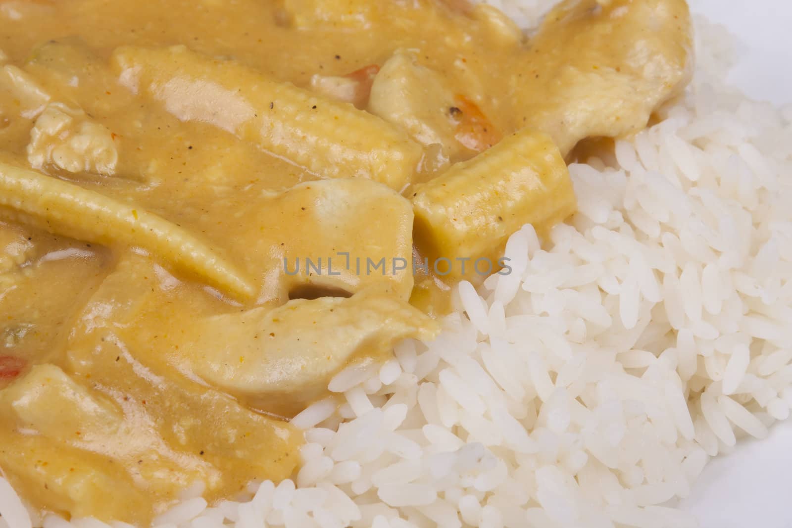 diced chicken in coconut curry sauce served with rice