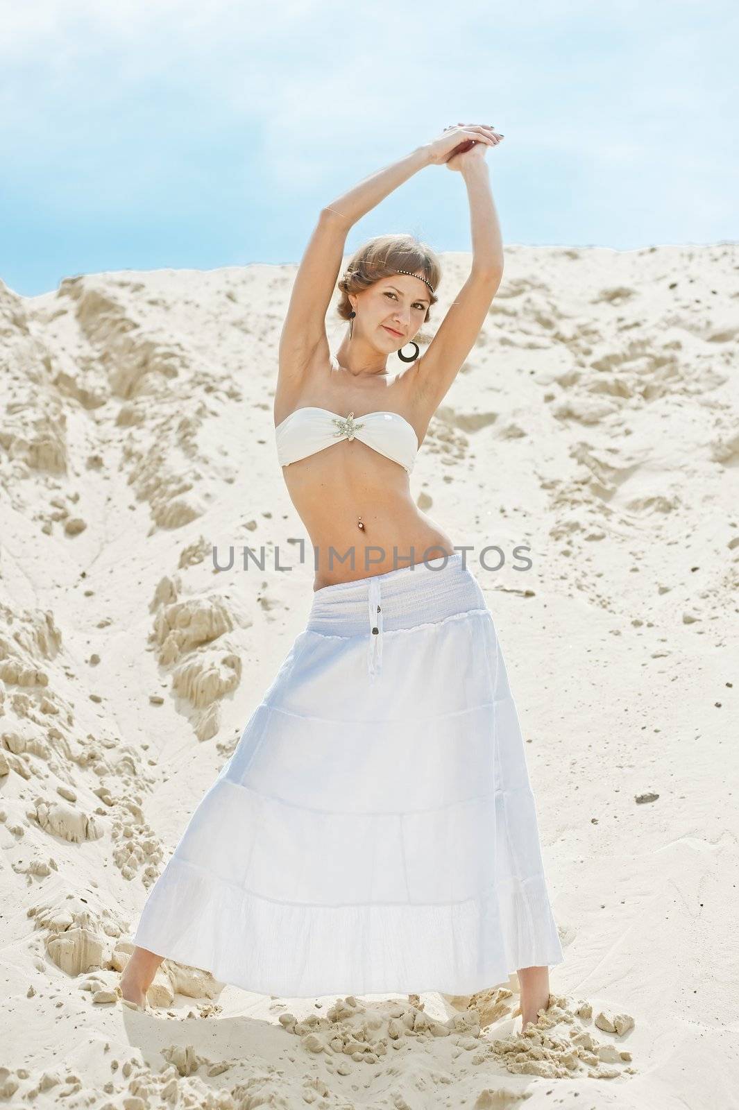 beautiful girl in a white skirt posing on a sand dune by kosmsos111