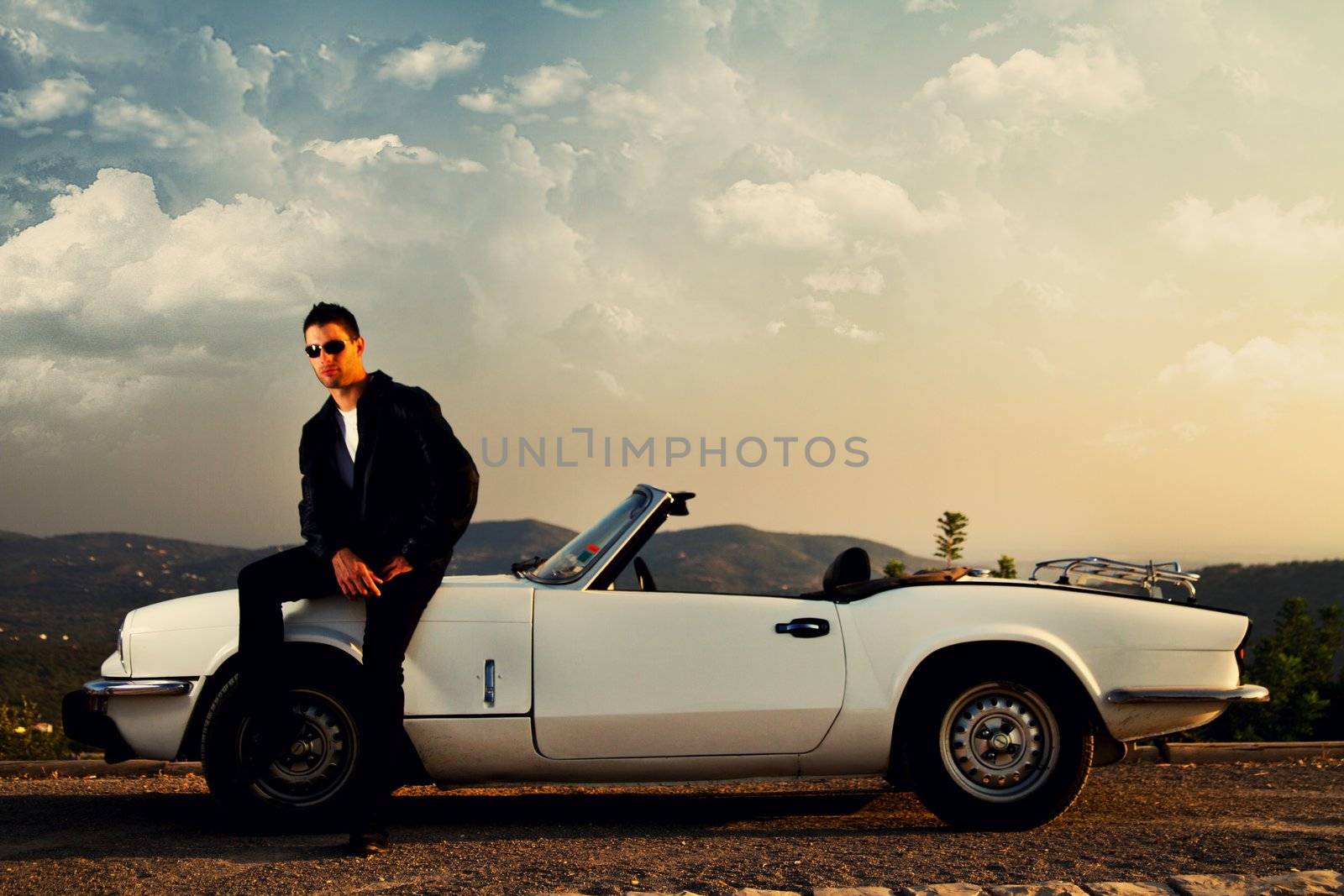 man with white convertible by membio