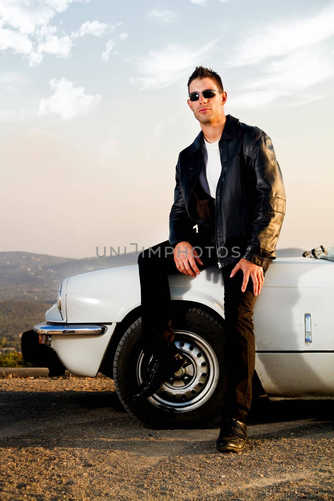 man with white convertible by membio