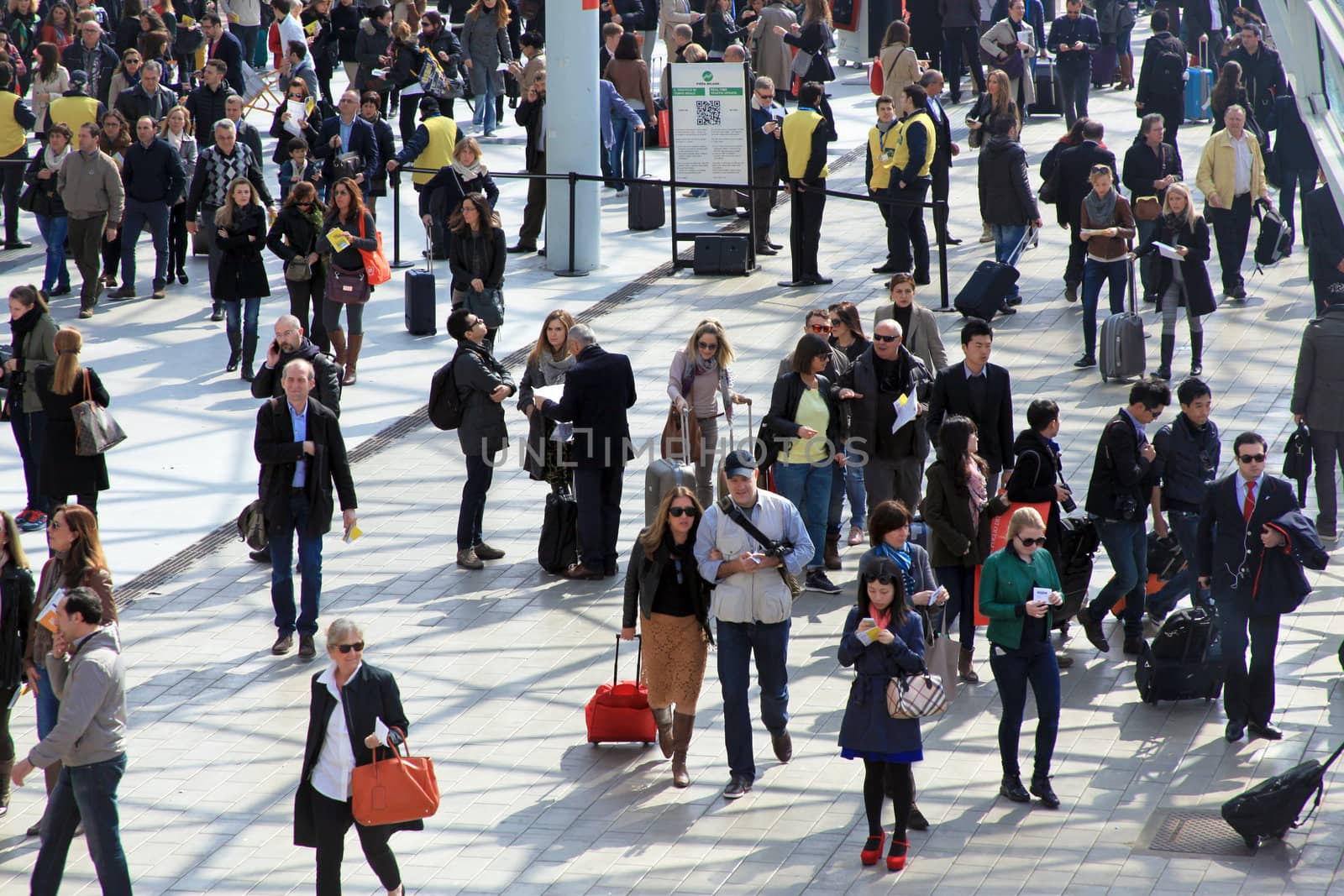 People enter Salone Internazionale del Mobile - International home furnishing and accessories exhibition