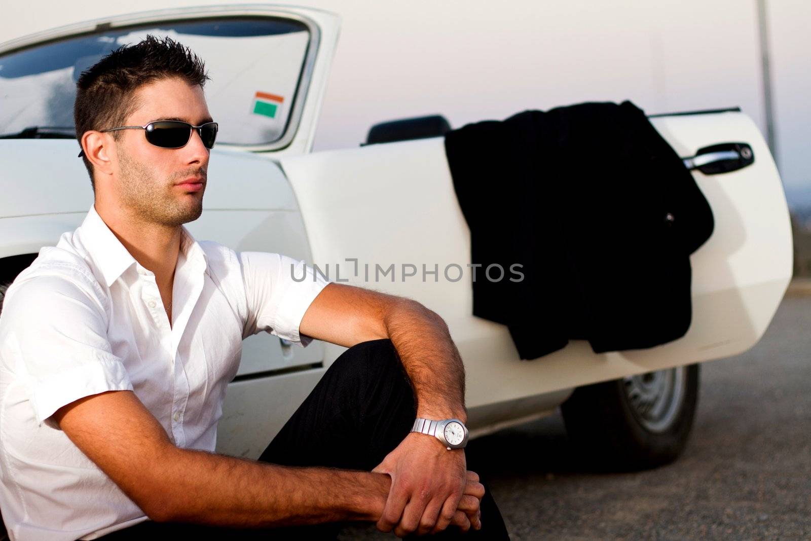 man with white convertible by membio