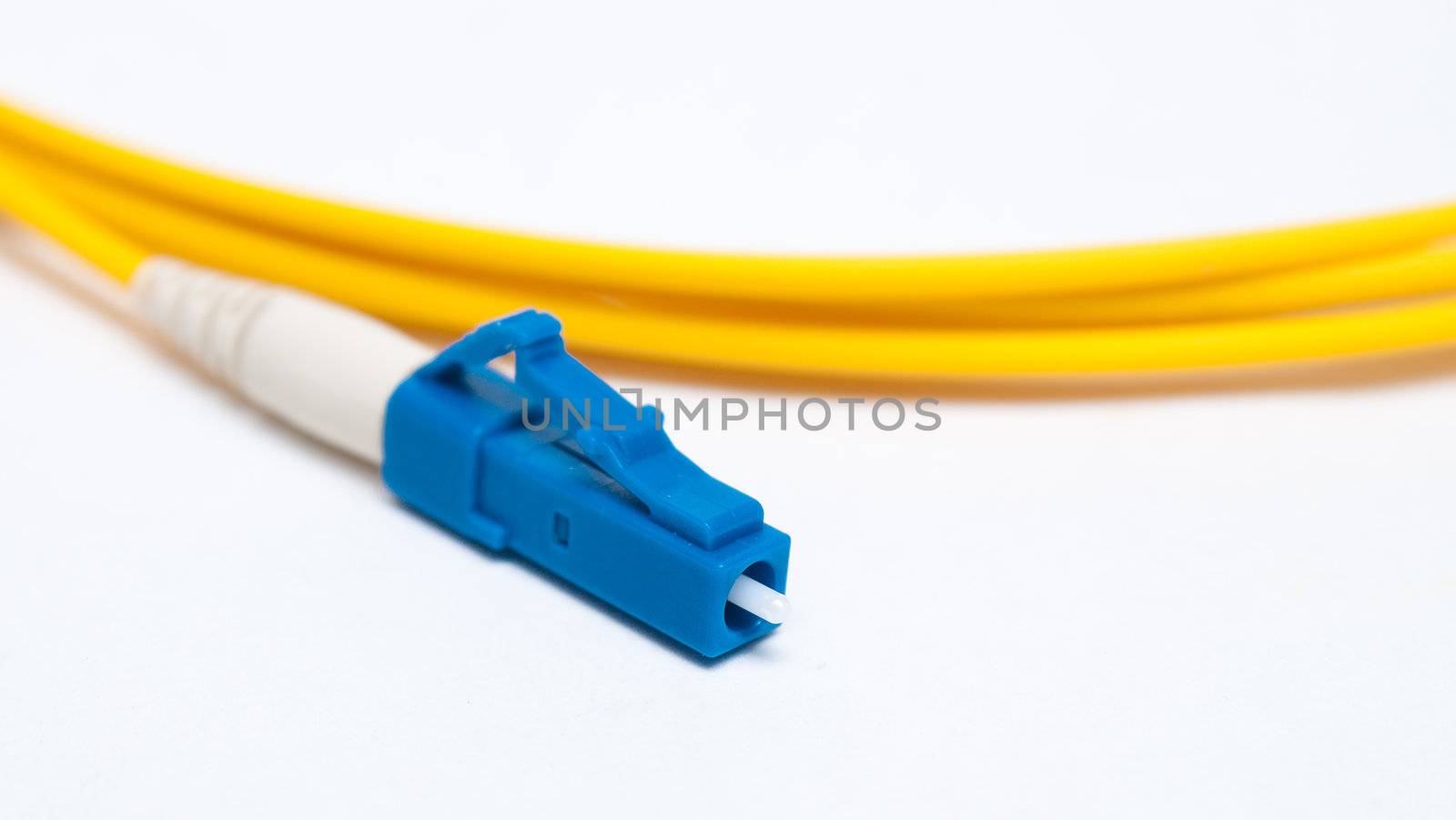 Optical single mode LC patch cord on white background.  by artush