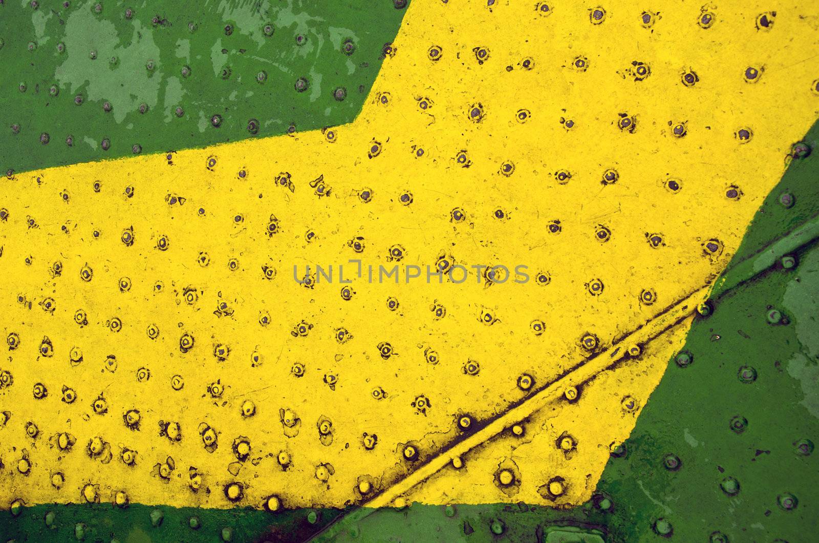 Green yellow paint metal floor closeup background by sauletas
