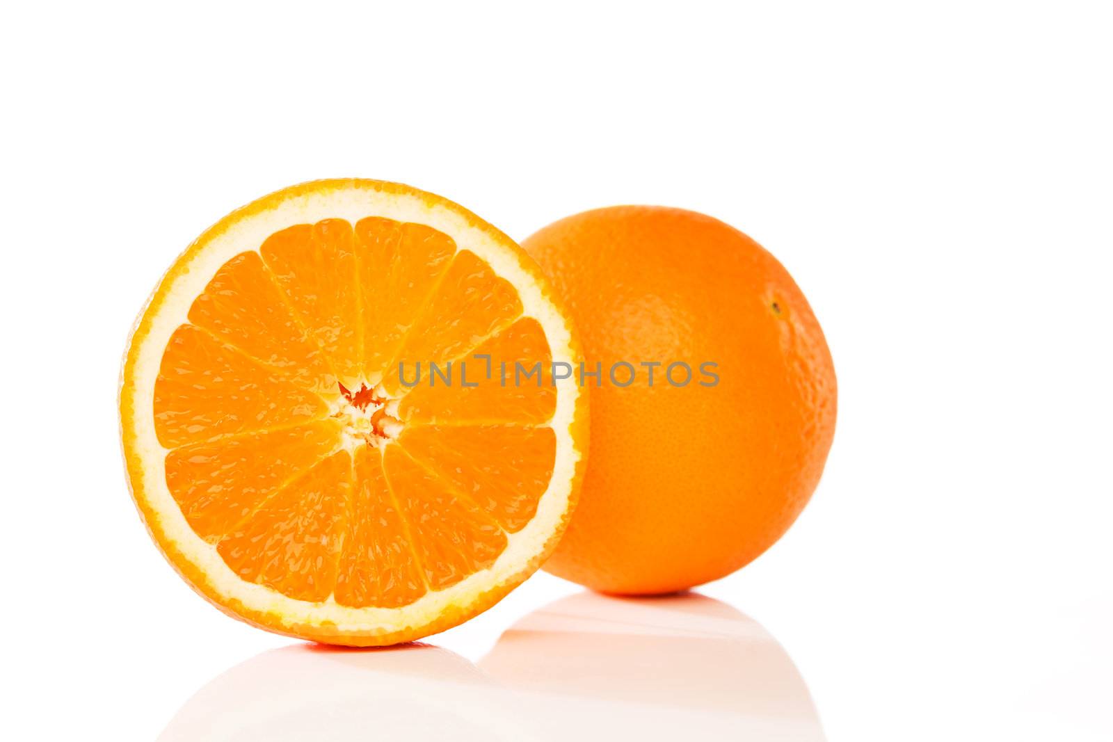 orange and a cutted half on white background