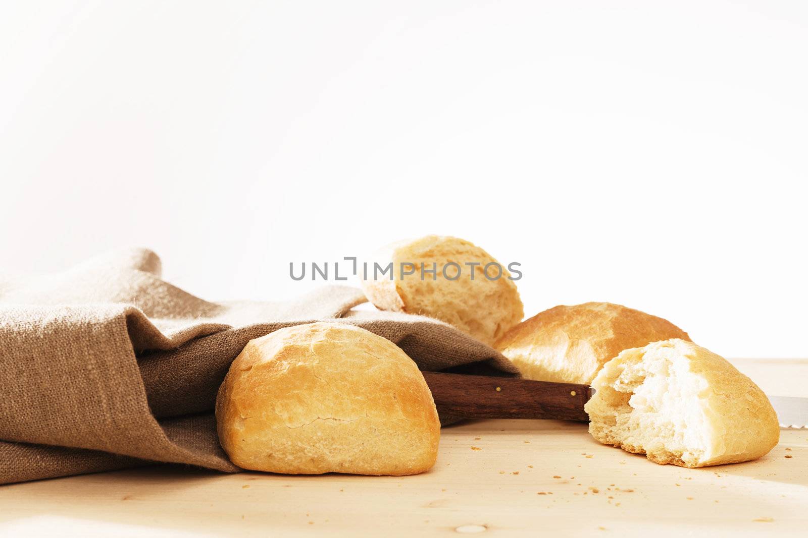 wheat buns and broken wheat bun with linen fabric