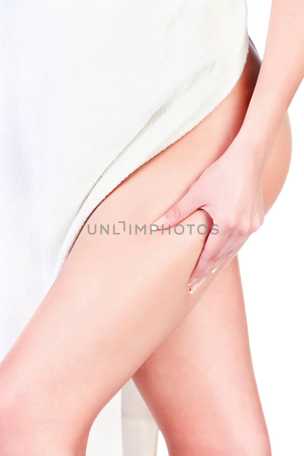 Woman with towel pinching leg for skin fold test, isolated on white. Health concept