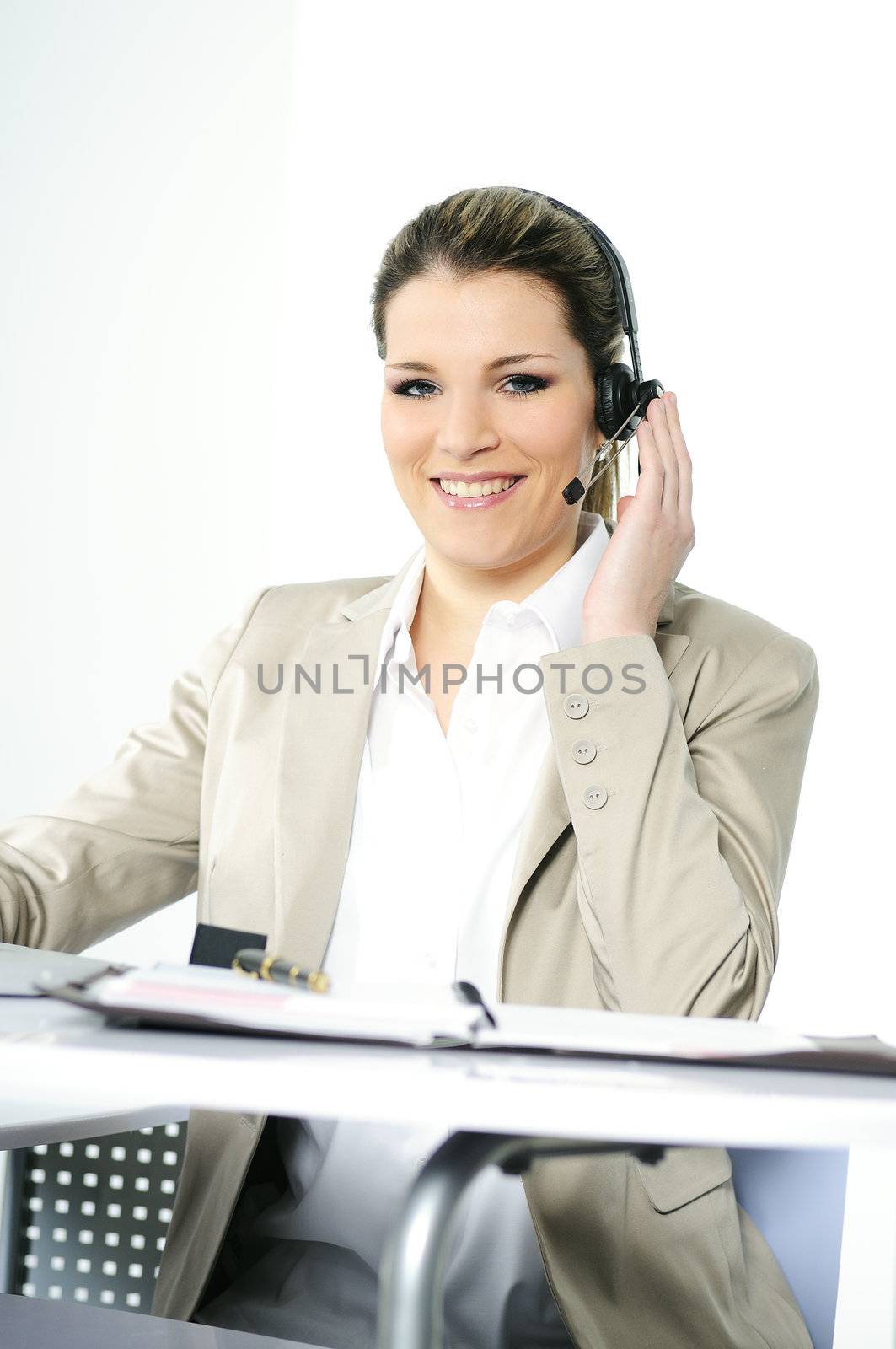 Face of young charming confident woman with headset