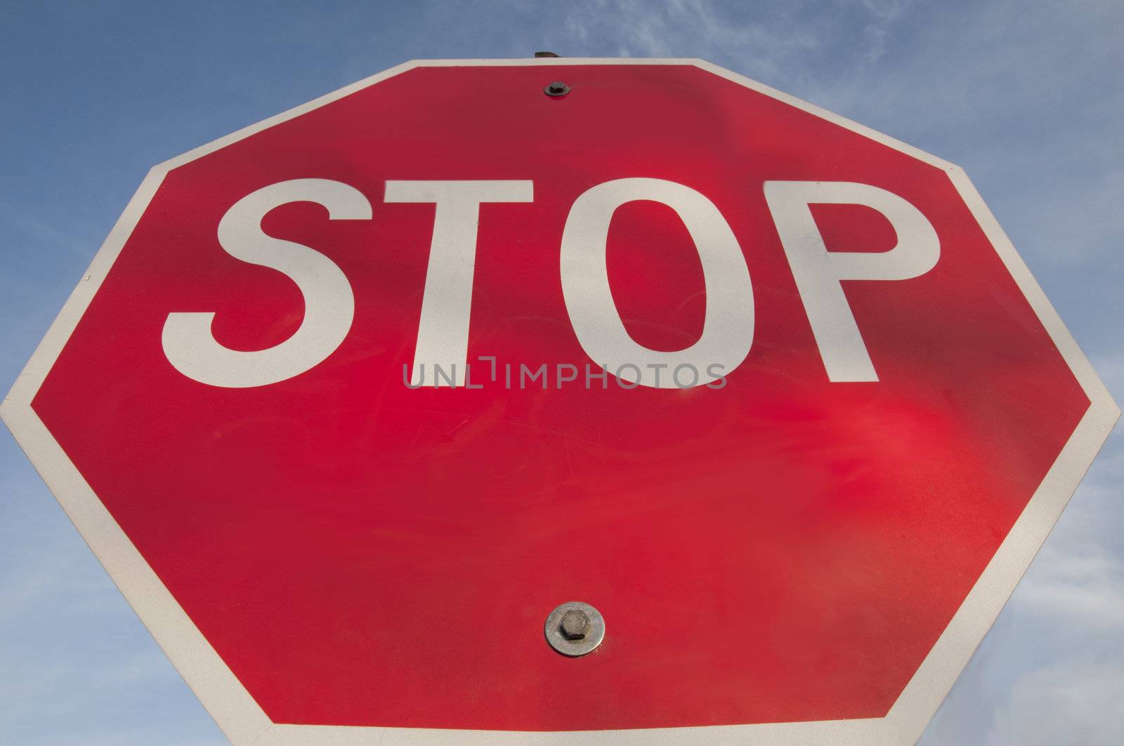 Image of a stop sign against a blue sky background.