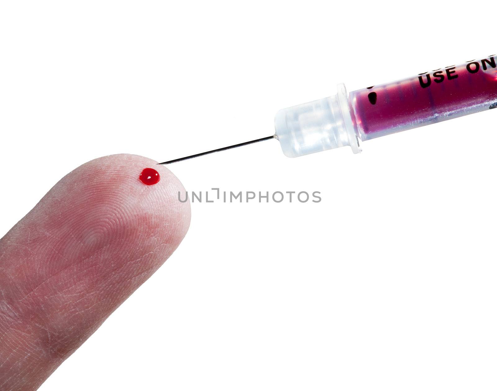 View of finger of senior male with drop of blood and hypodermic syringe