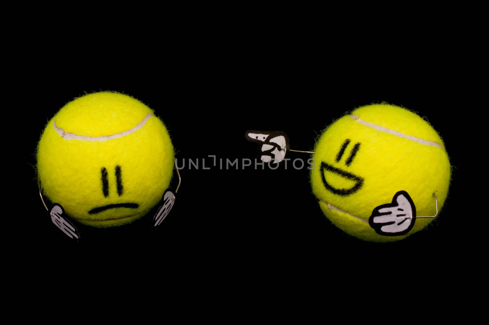 Tennis ball hurting another yellow tennis ball, one laugh, another is sad
