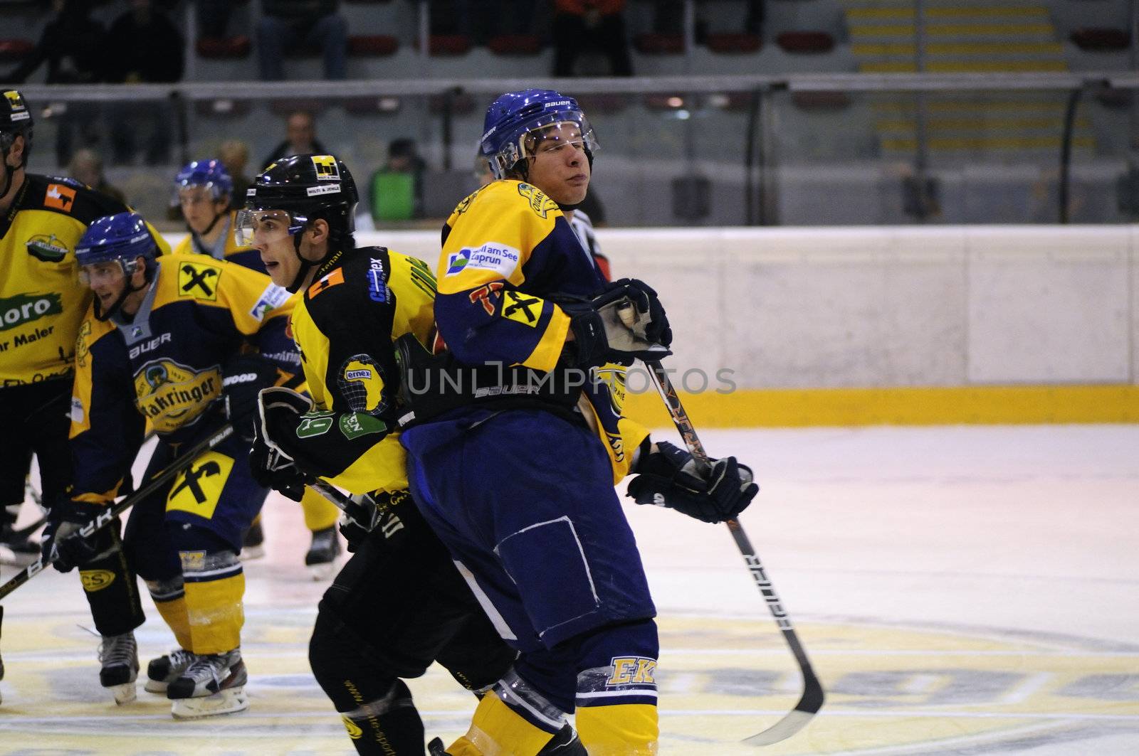 ZELL AM SEE; AUSTRIA - SEPT 24: Austrian National League. The team of EKZ (blue jersey) and the team of Lustenau fight for ervery inch on the ice. Game EK Zell am See vs EHC Lustenau (Result 1-8) on September 24, 2011 in Zell am See.