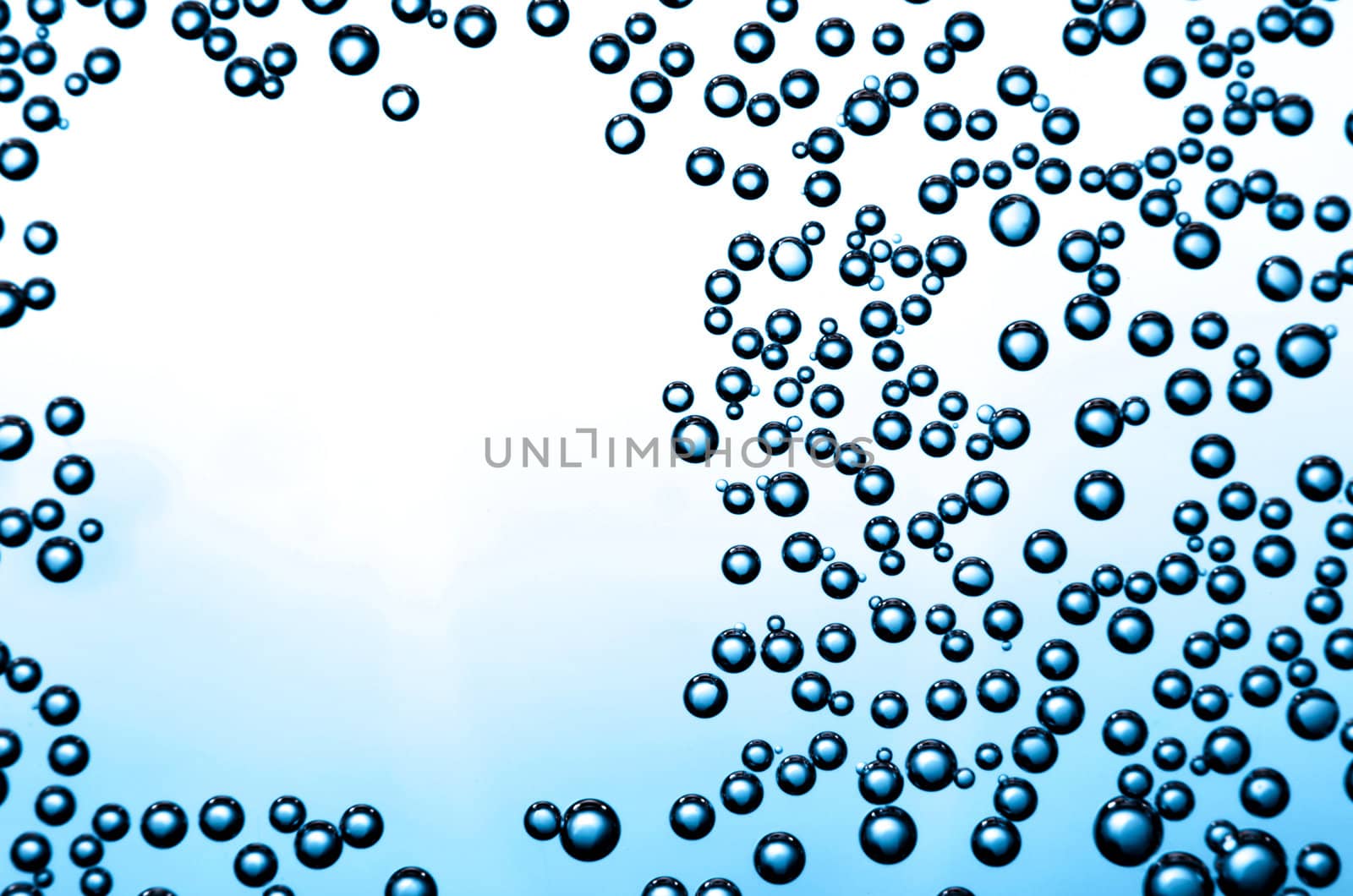Gradient background with frame of bubbles on a glass.