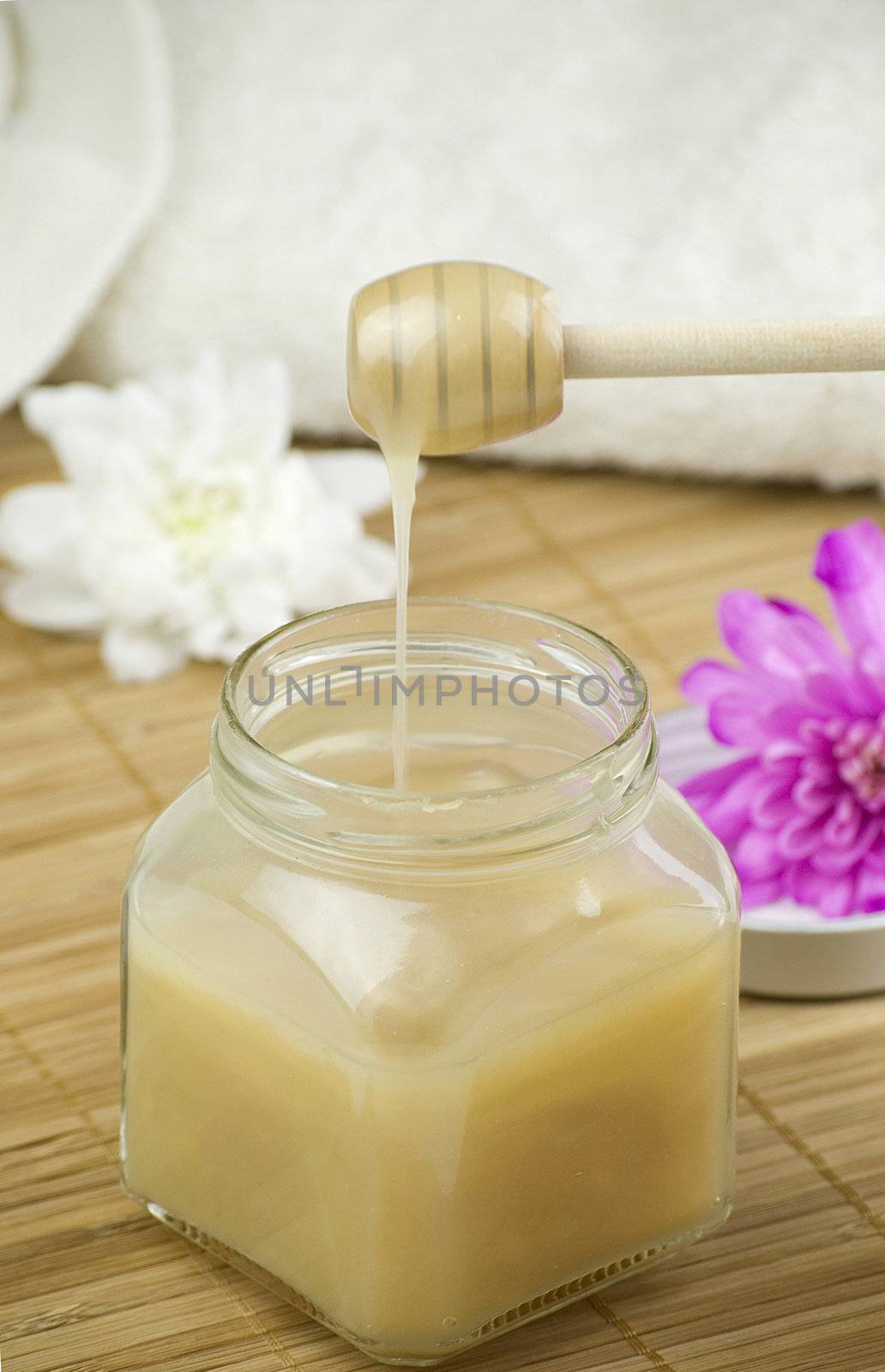 relaxing aroma of almond coconut vanilla milk and honey bath foam over wooden mat