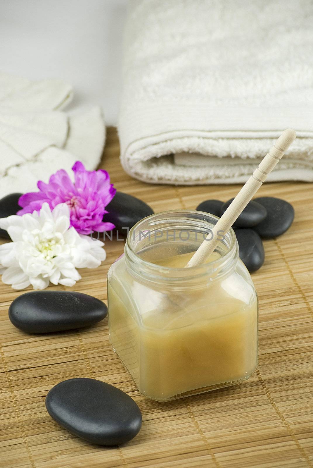 relaxing aroma of almond coconut vanilla milk and honey bath foam over wooden mat