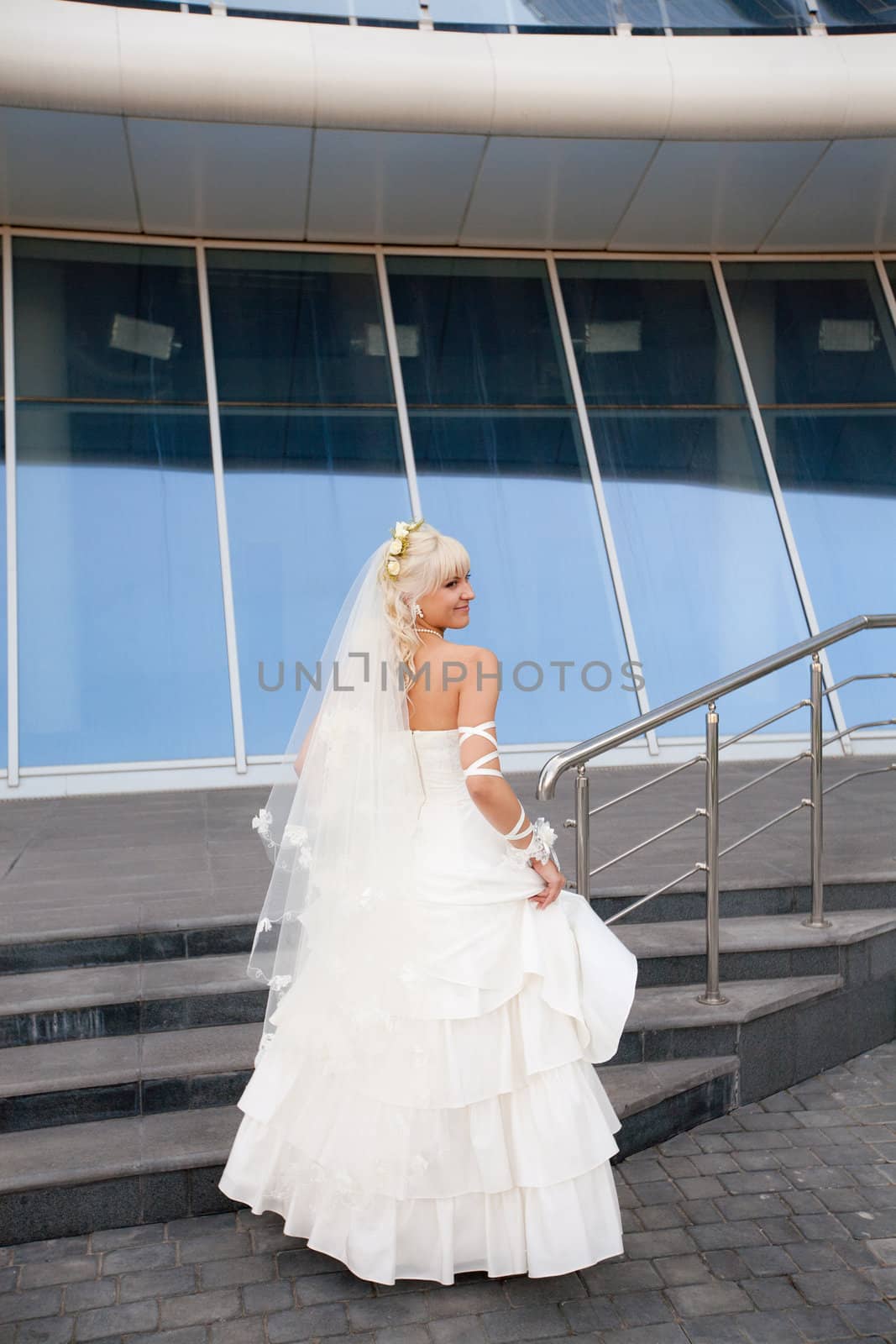 happy bride on the staircase