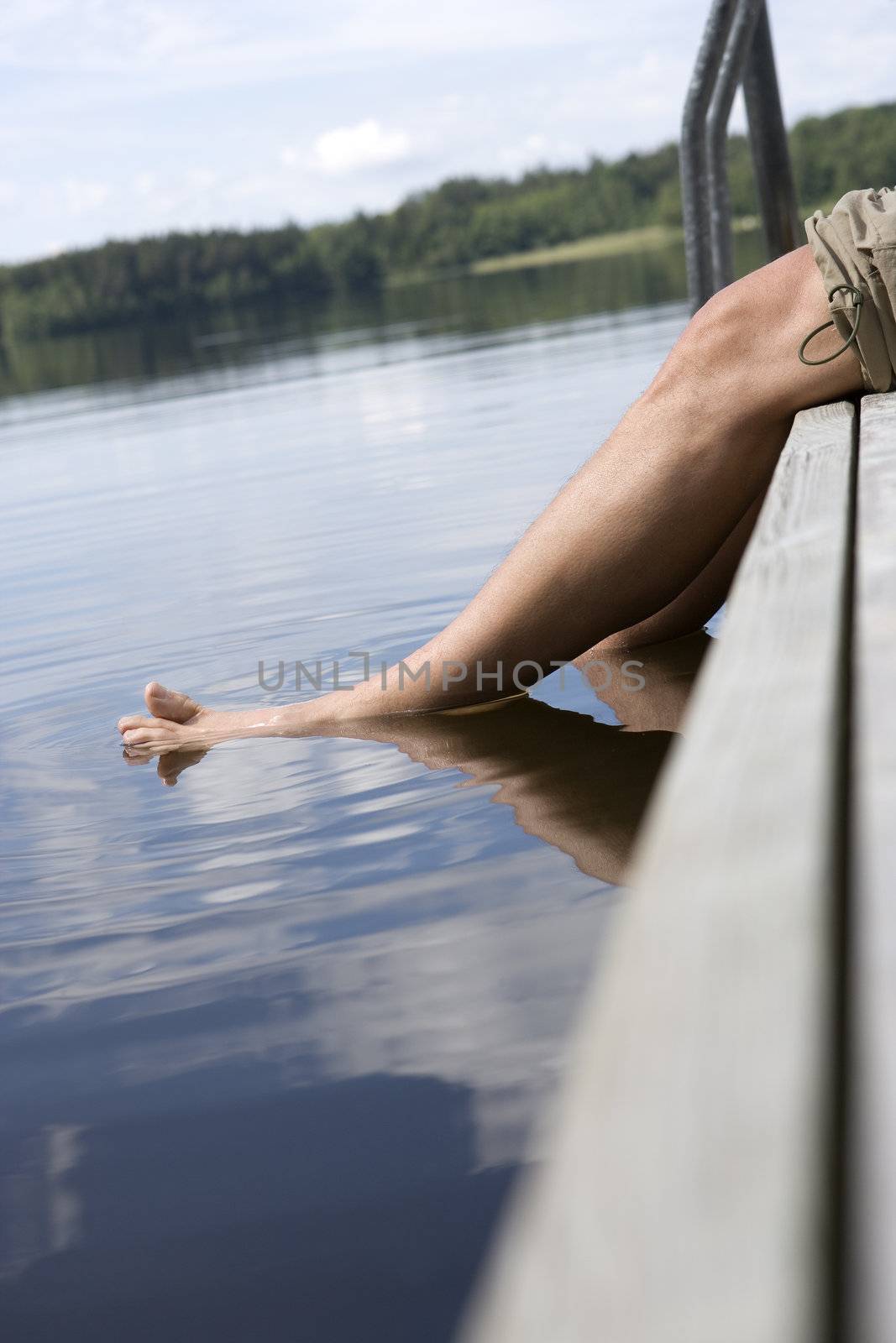 Man with feet in the water