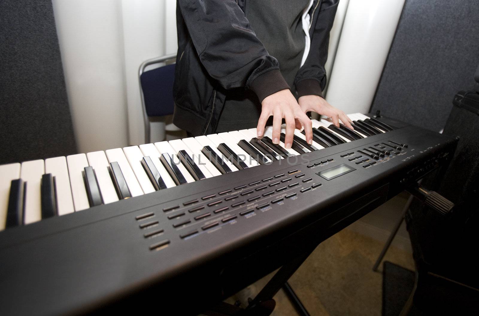 Unreconizable man playing the piano