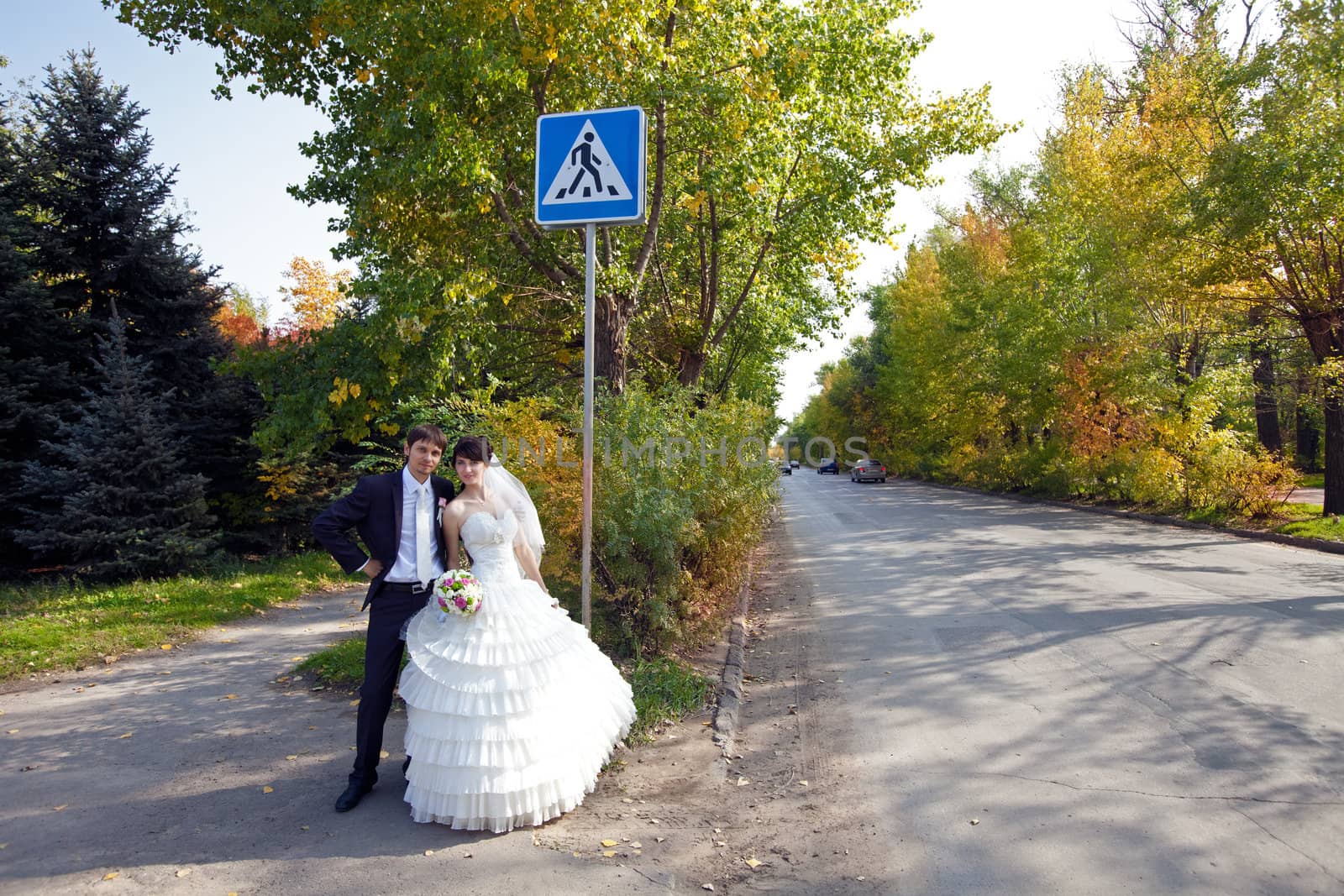bride and groom near the sign by vsurkov