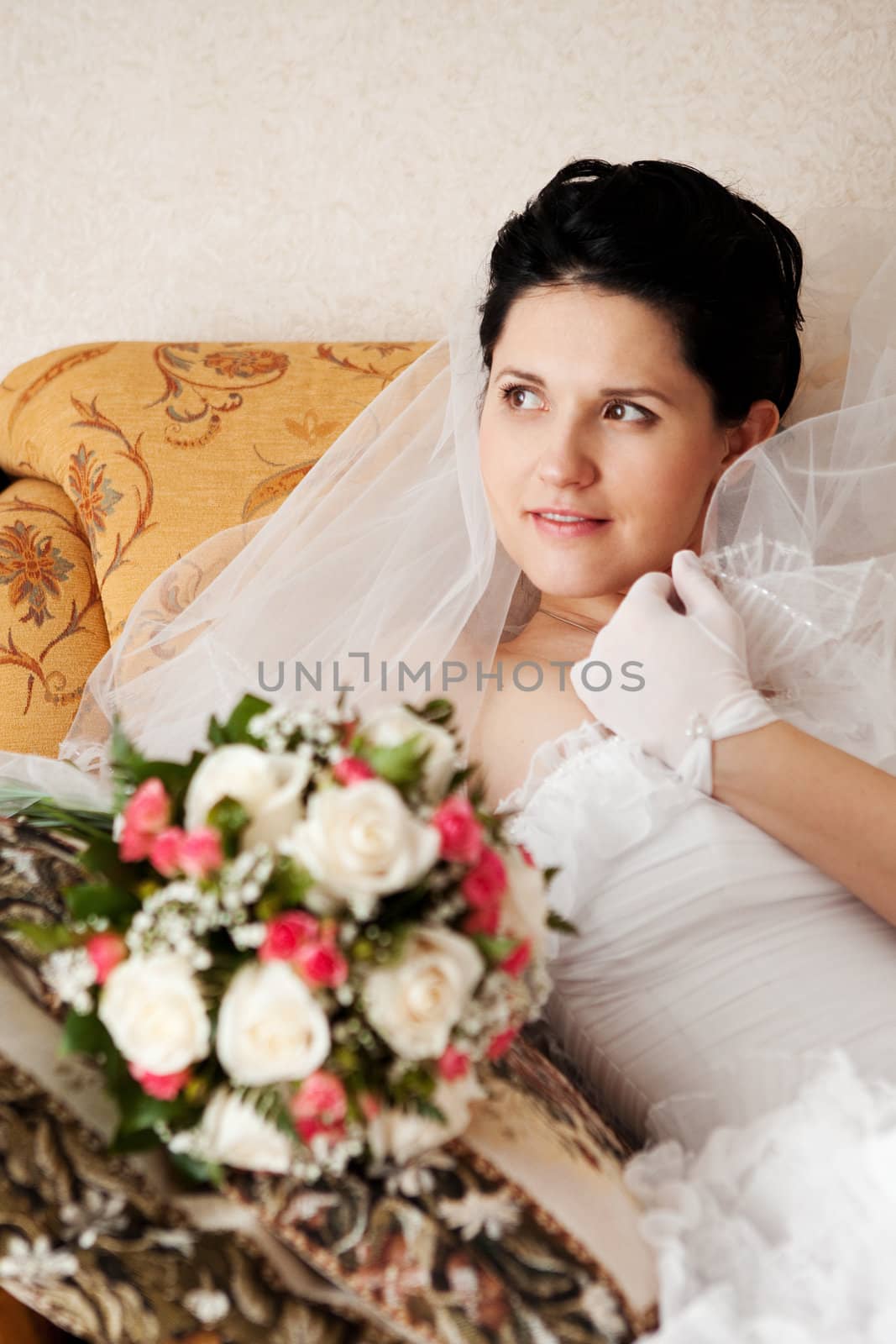 happy bride sit on the sofa