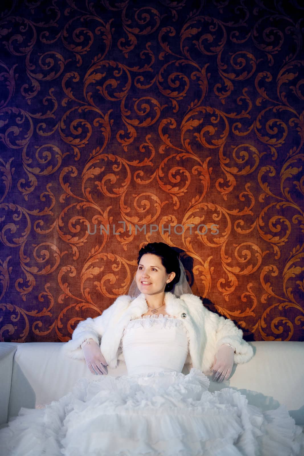 happy bride on the sofa by vsurkov