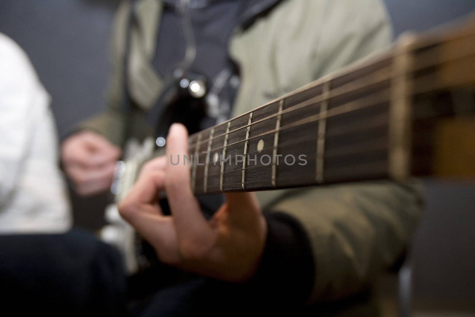 Unreconizable man playing the guitar