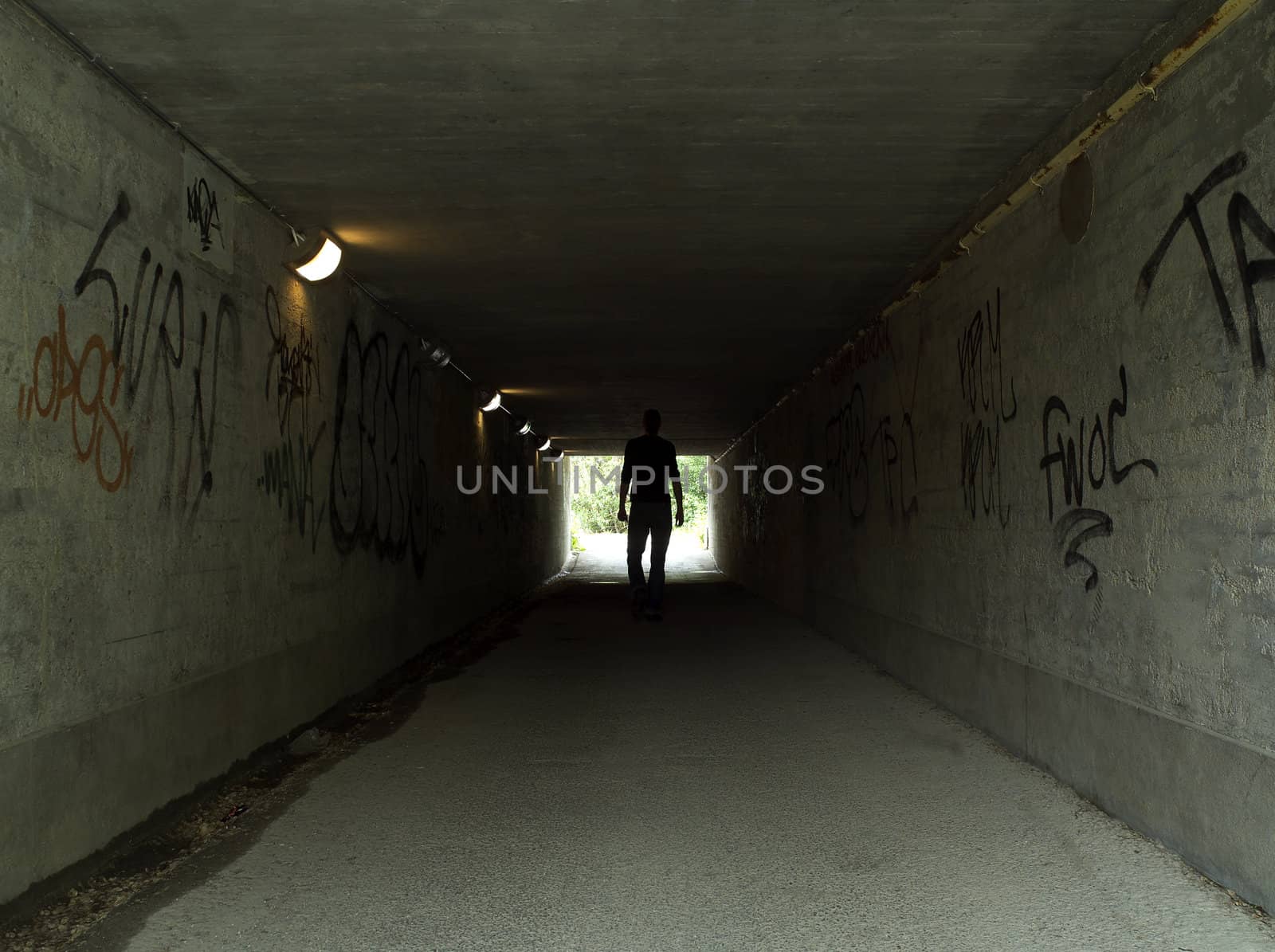 Man in a dark tunnel