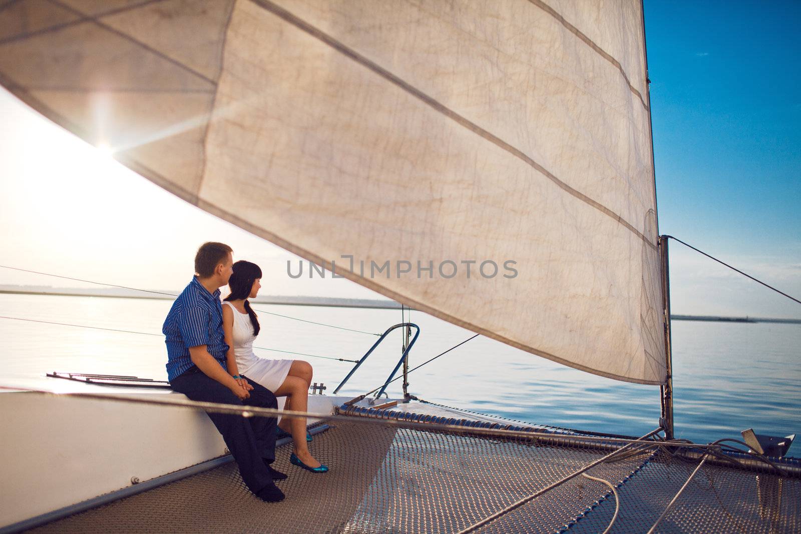 man and girl under the sail