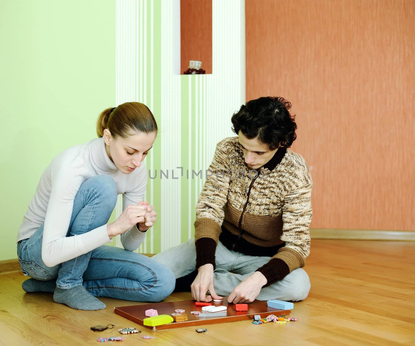 Young couple sculpts out of clay