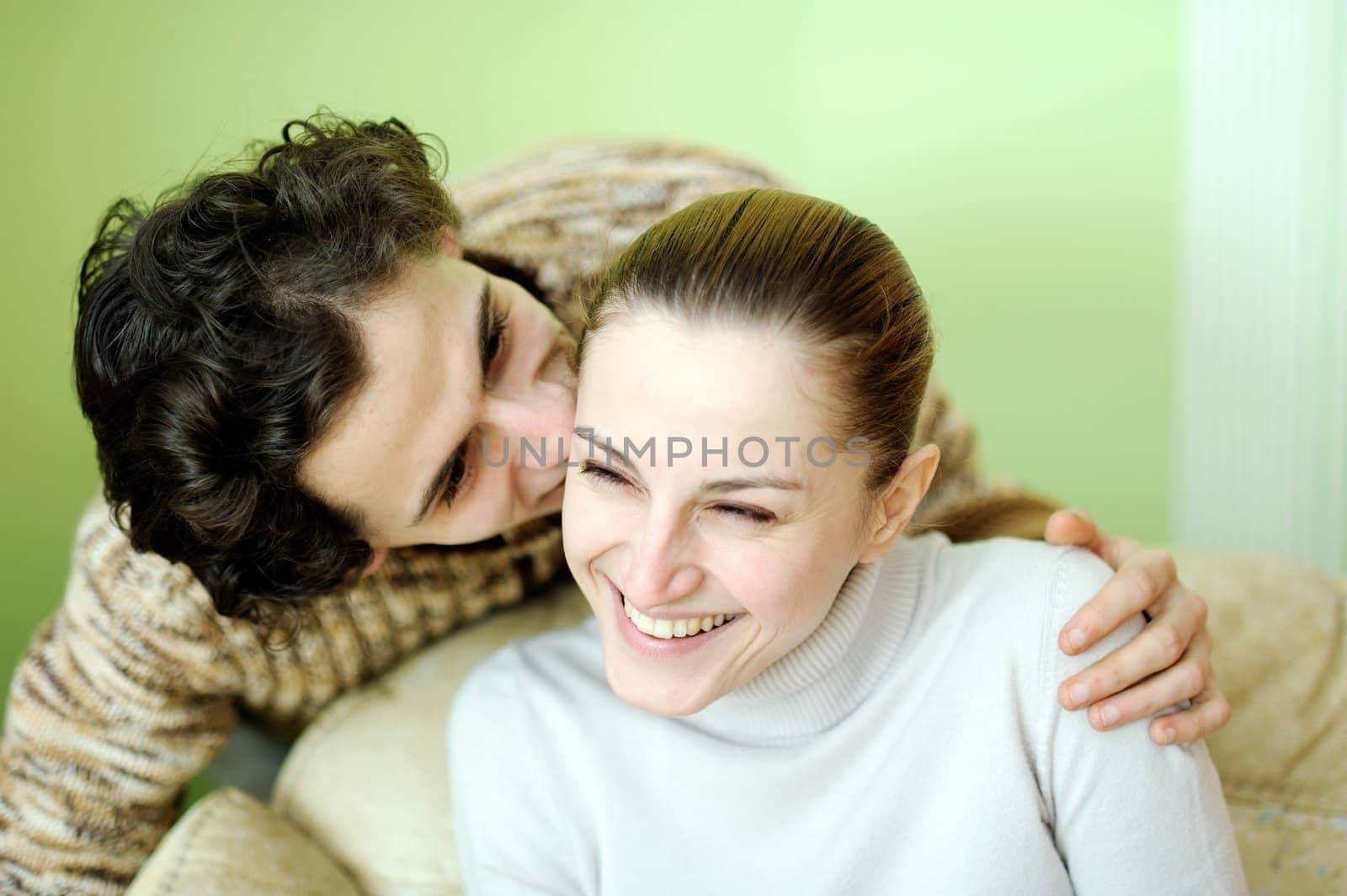 Fun young couple. Tight focus on girl. 