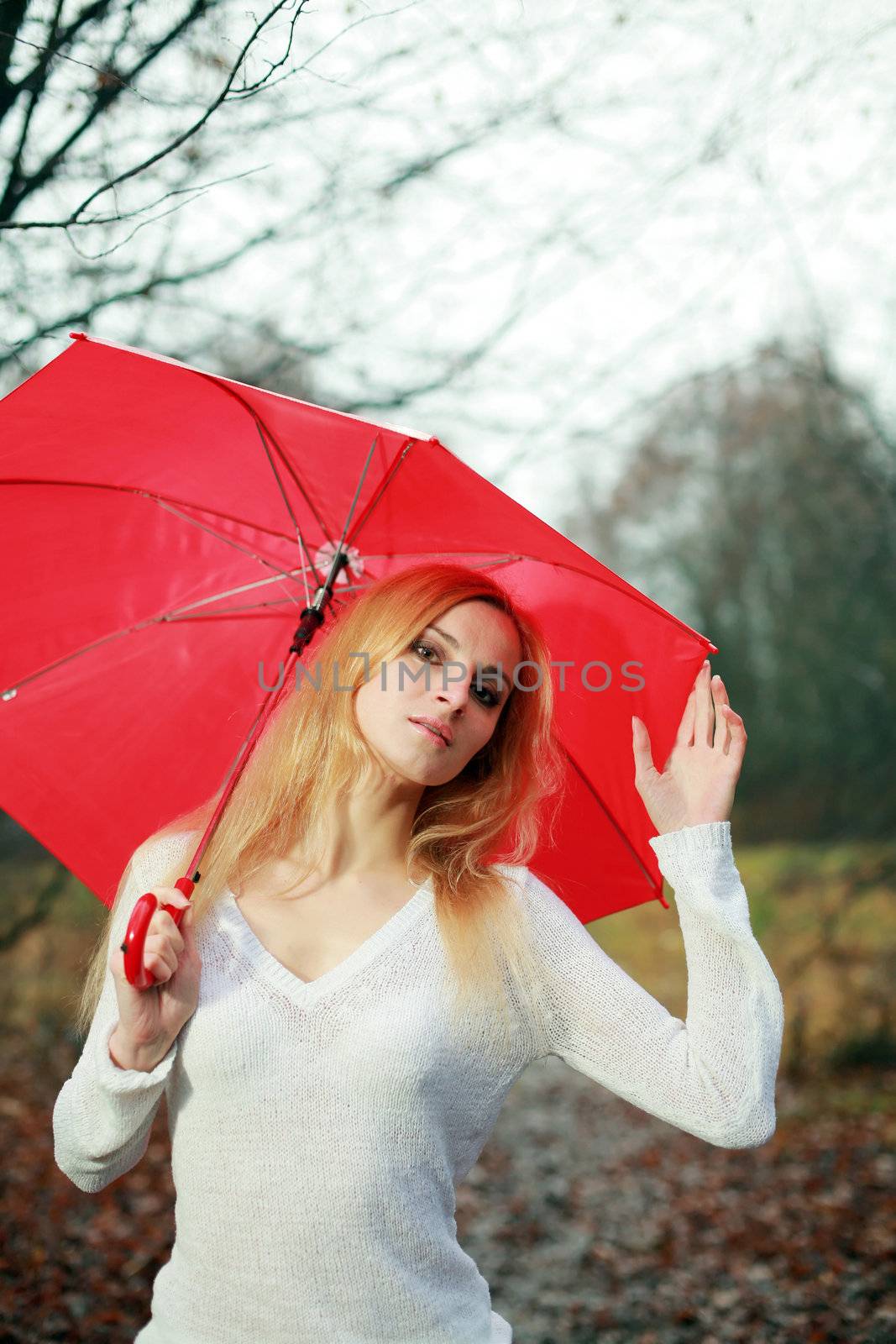 Woman with umbrella by velkol