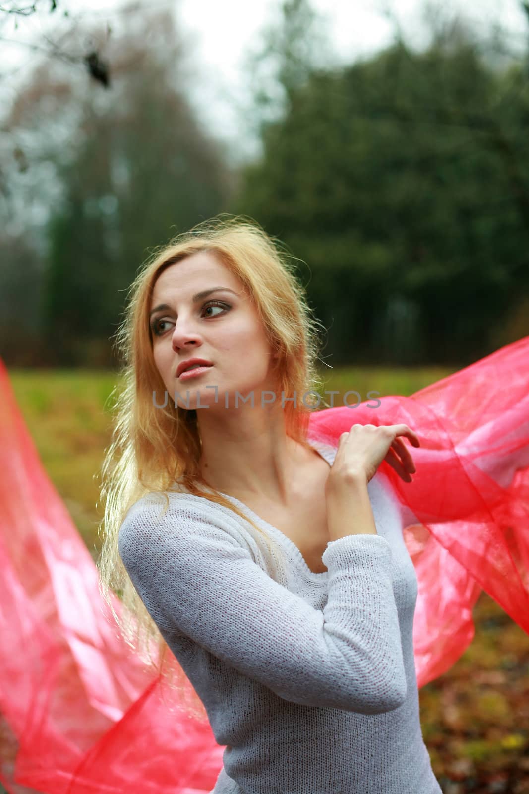 An image of a young woman with a red shawl