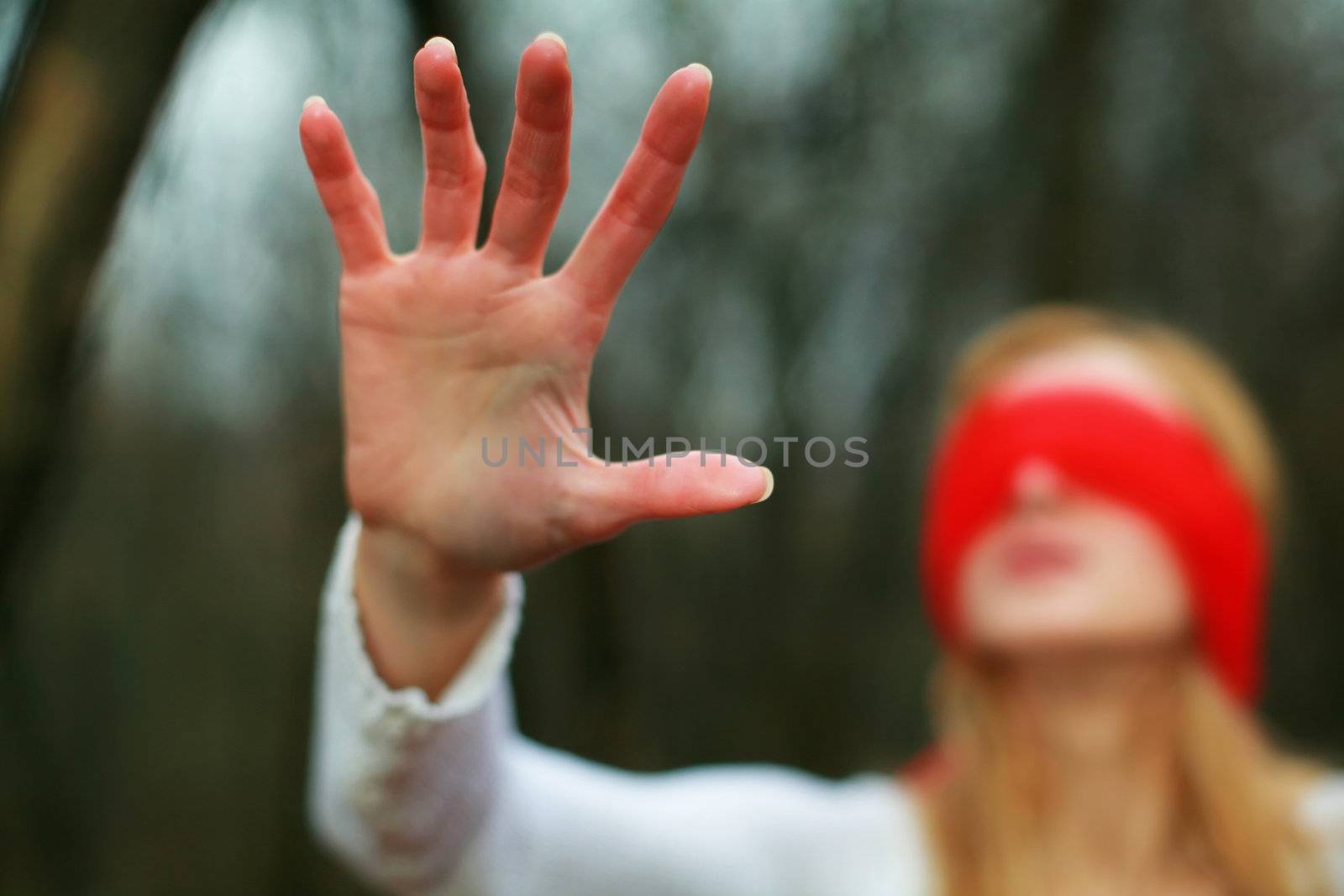 An image of woman with red blindfold