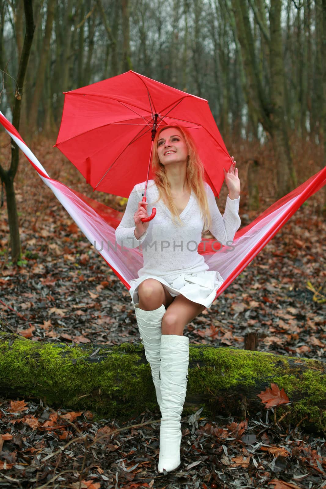 An image of happy girl with red umbrella
