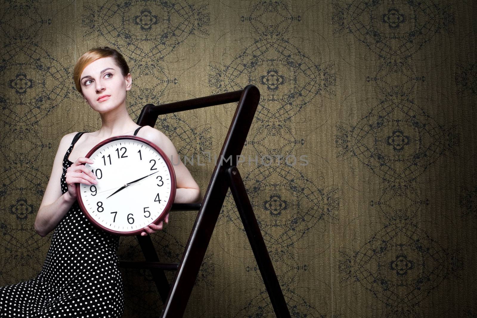 An image of a woman with a big clock