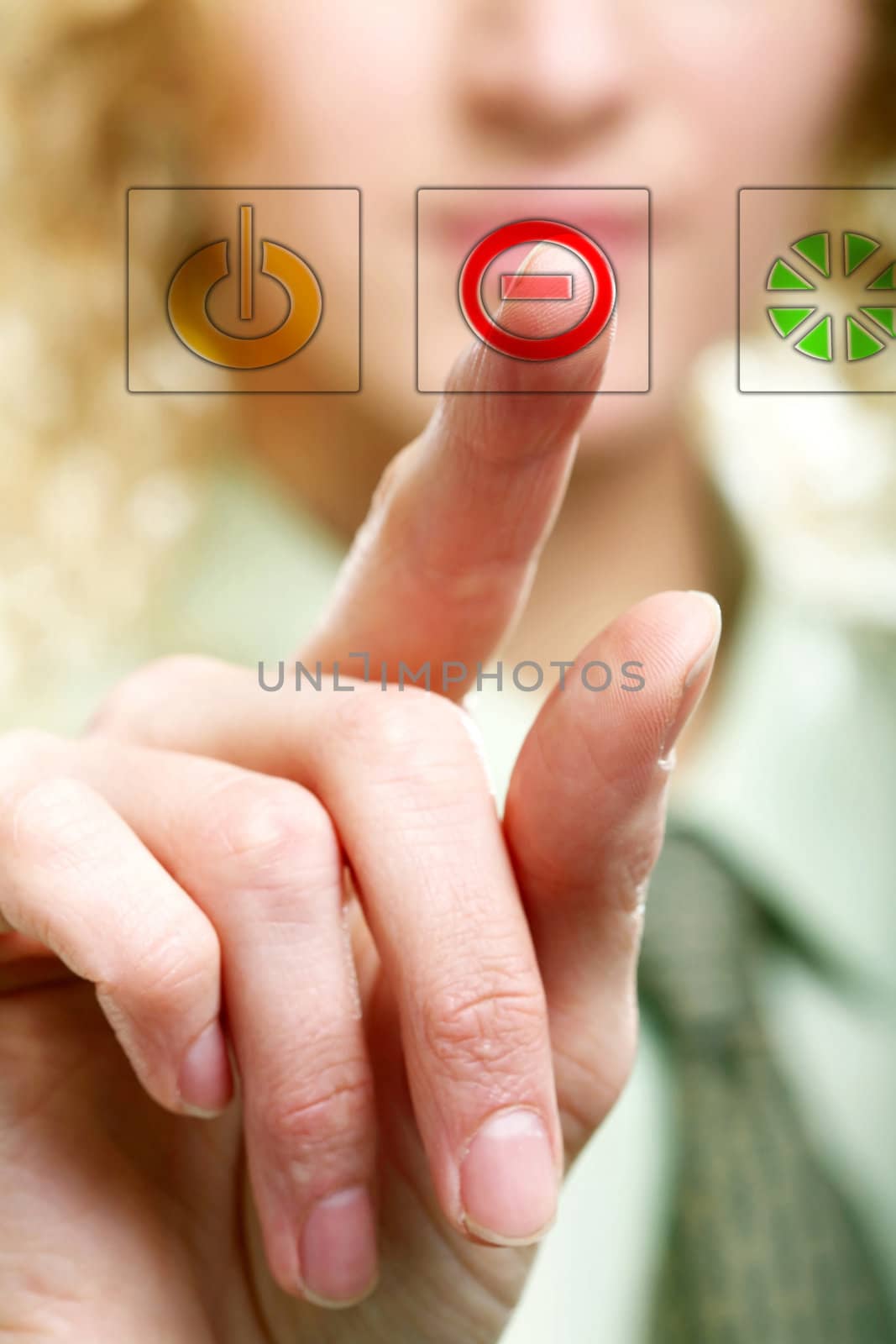 An image of a finger pressing a button