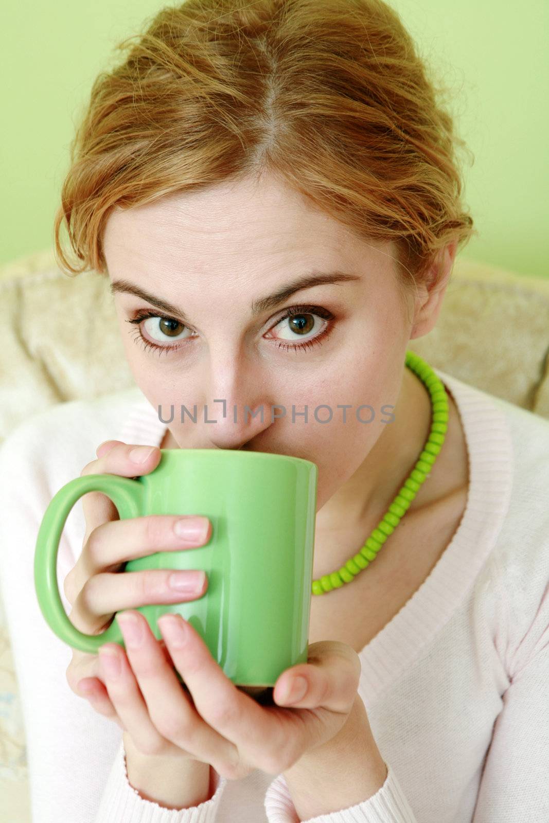 An image of a woman drinking tea