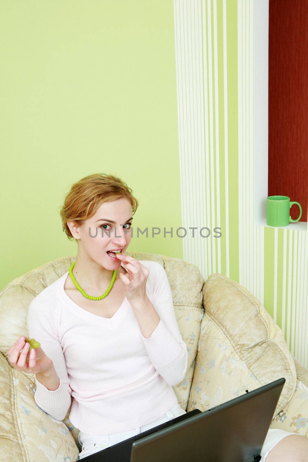 An image of a girl sitting in armchair