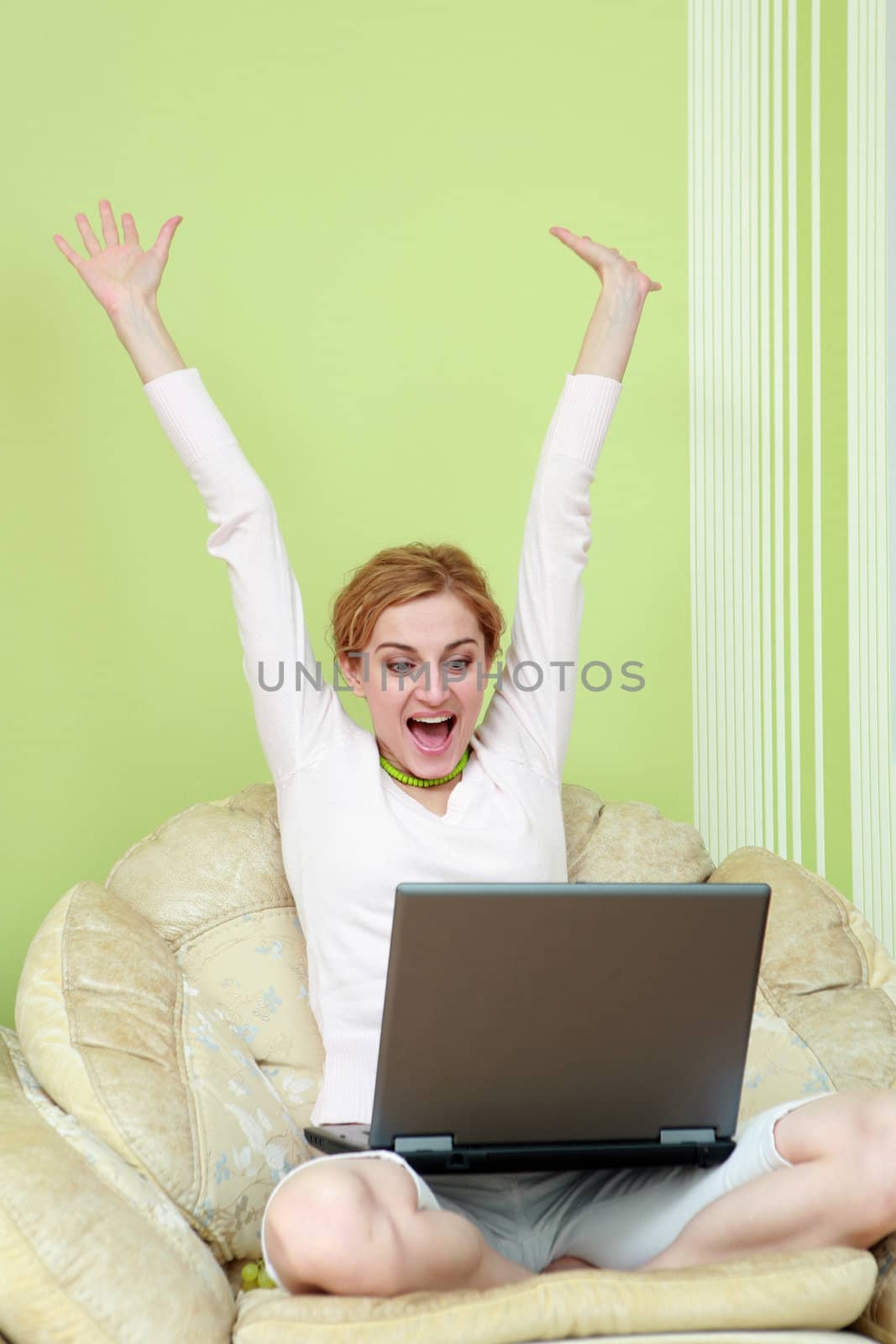 An image of nice girl with a laptop at home
