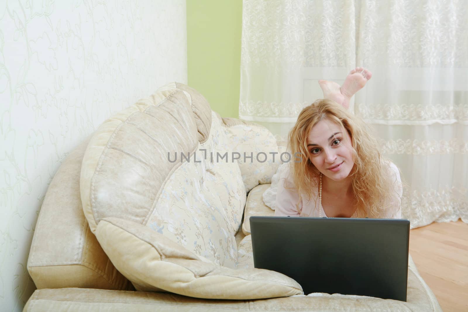 An image of a nice woman on a sofa