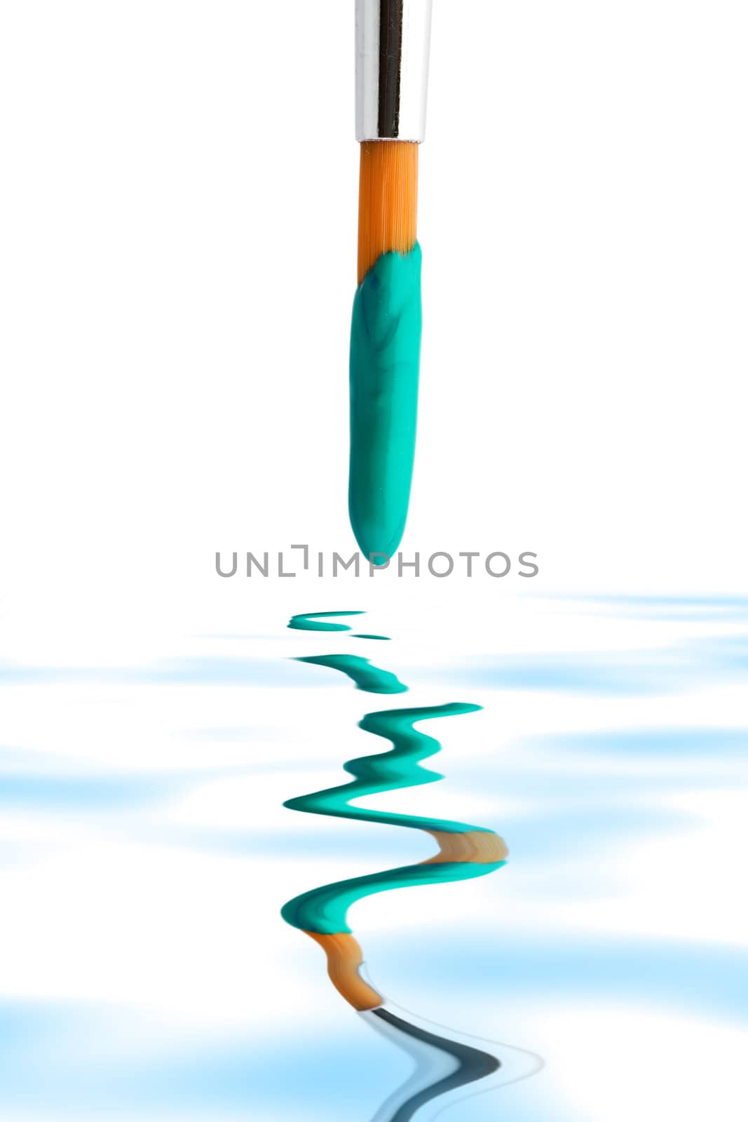 Stock photo: an image of a brush with green paint on it