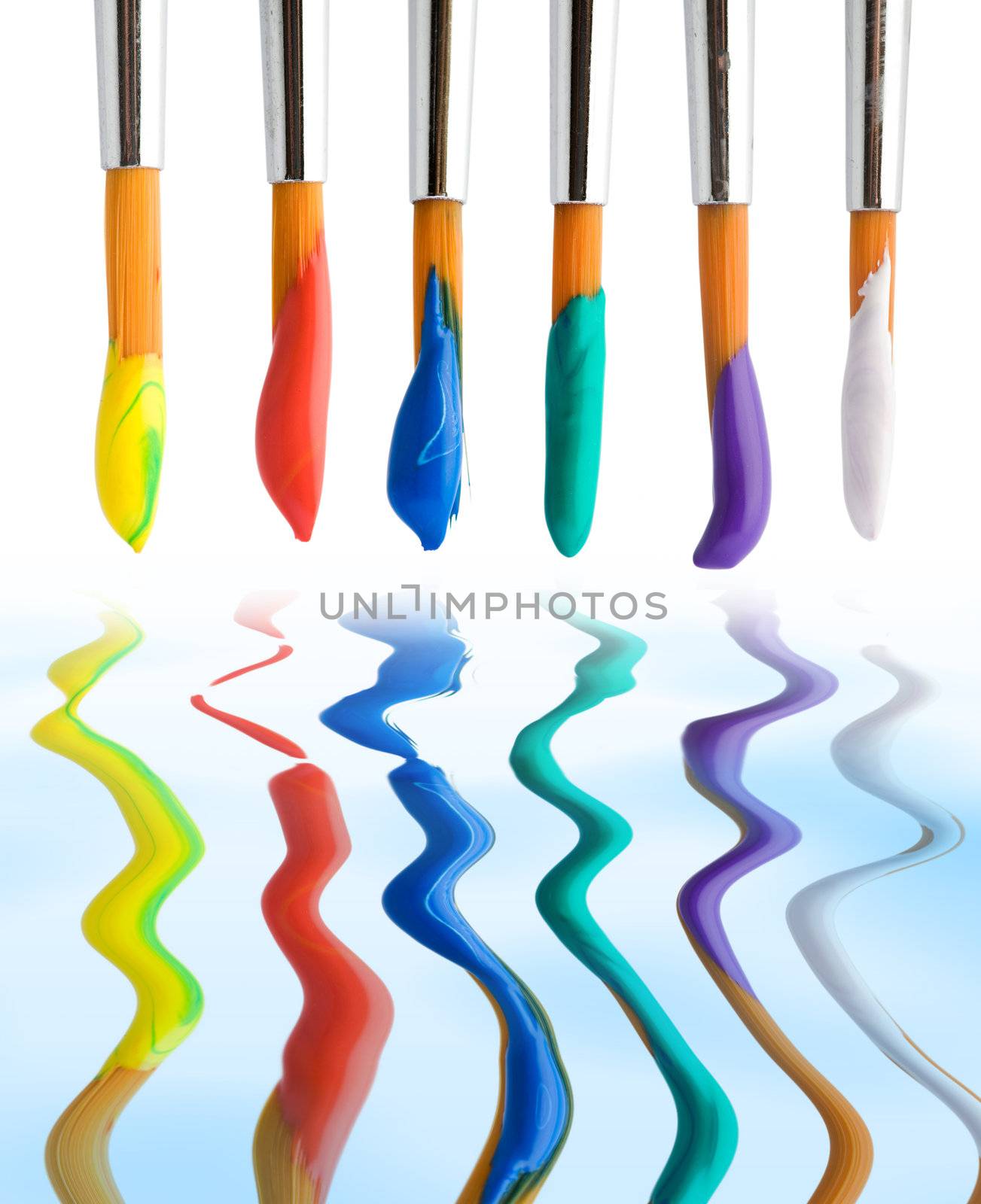 Stock photo: an image of a set of paintbrushes with paints 
