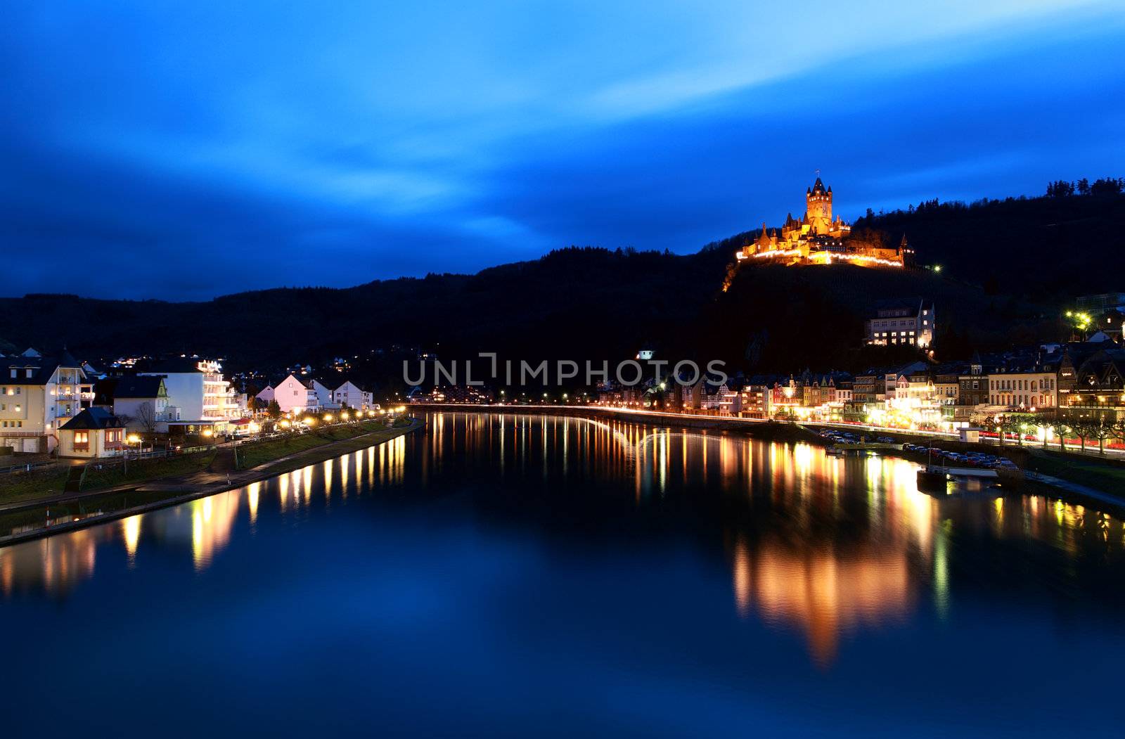 small town Cochem with river and castle at night