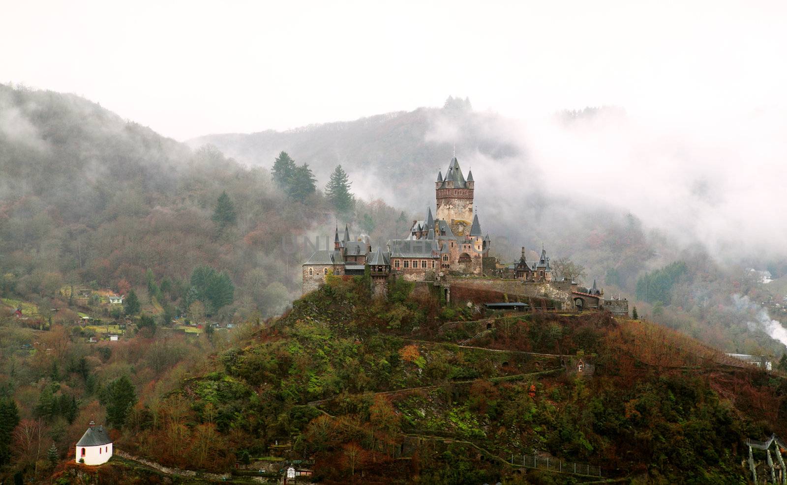 castle in the mountains in the fog