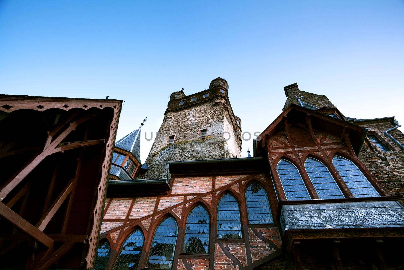 fragment of architecture of castle in Cochem, Germany, over blue sky