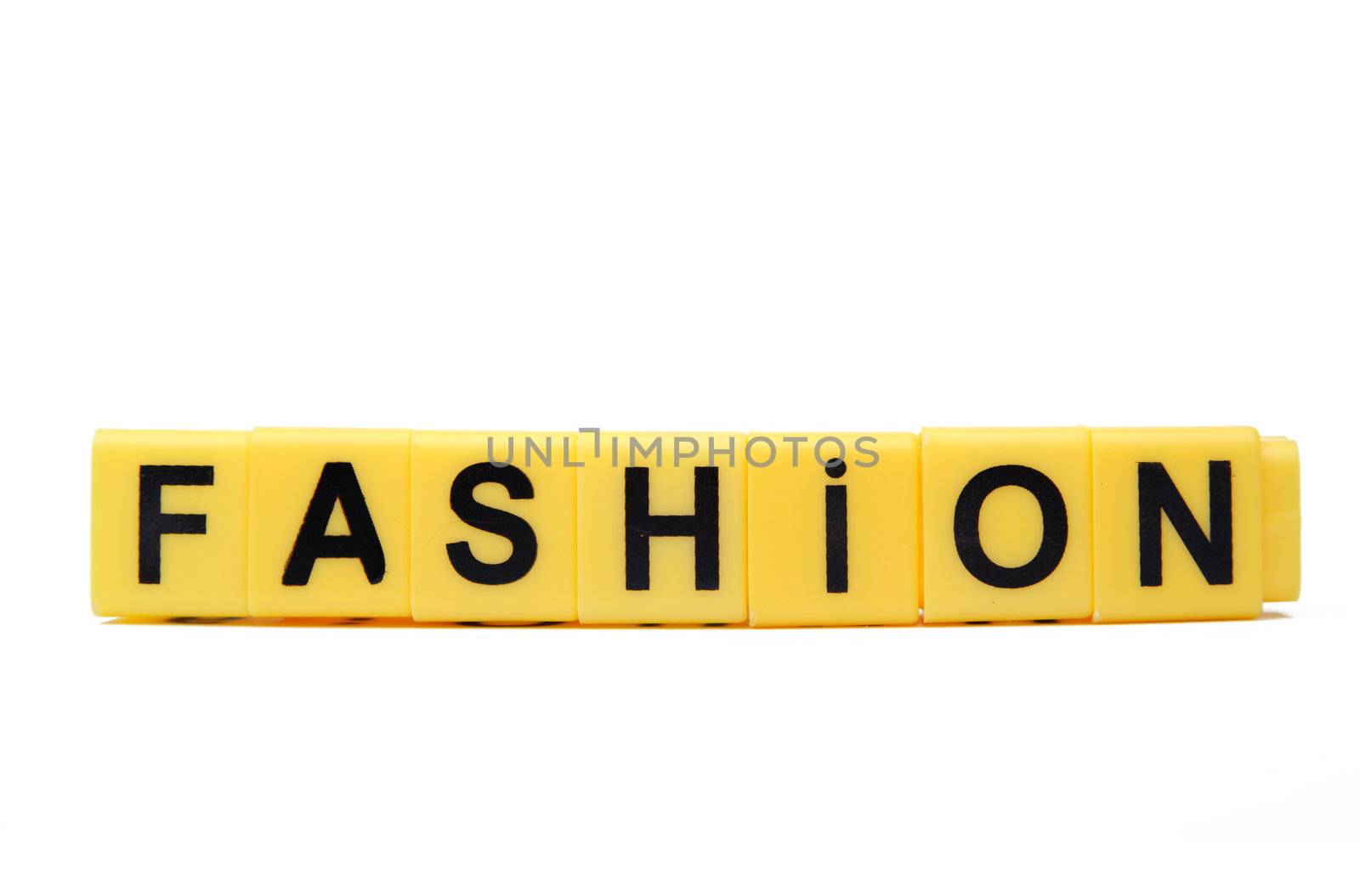 An image of yellow blocks with word ''fashion'' on them