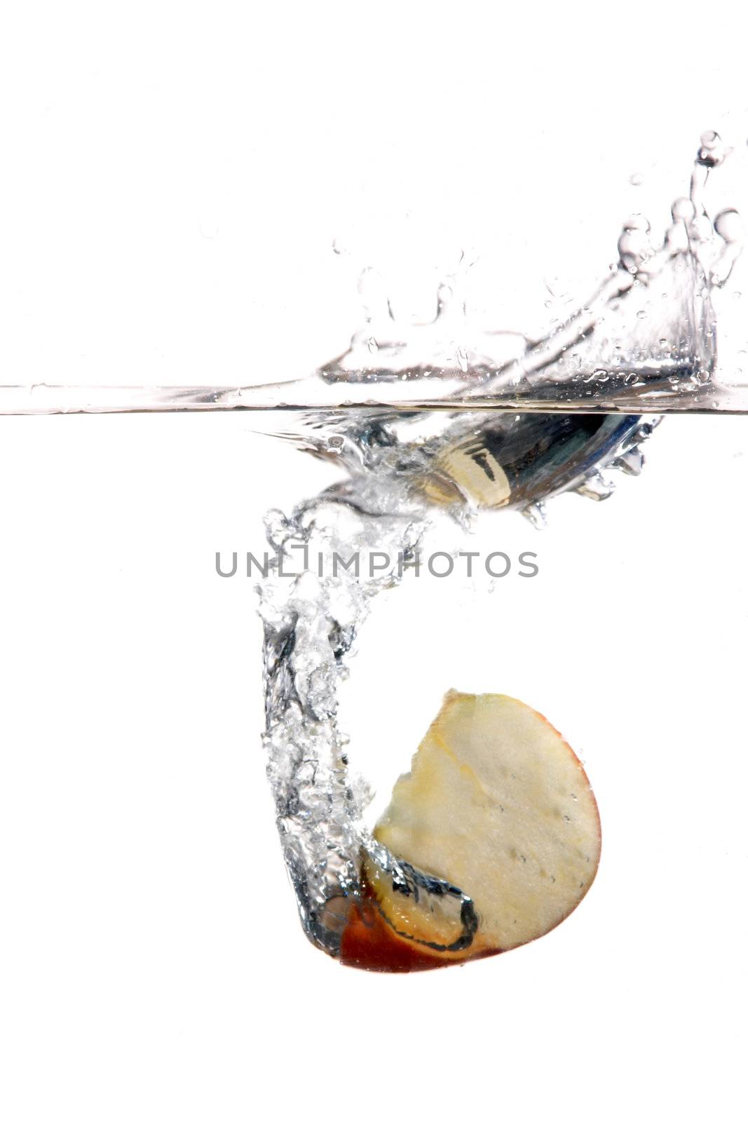 An image of slice of apple in water
