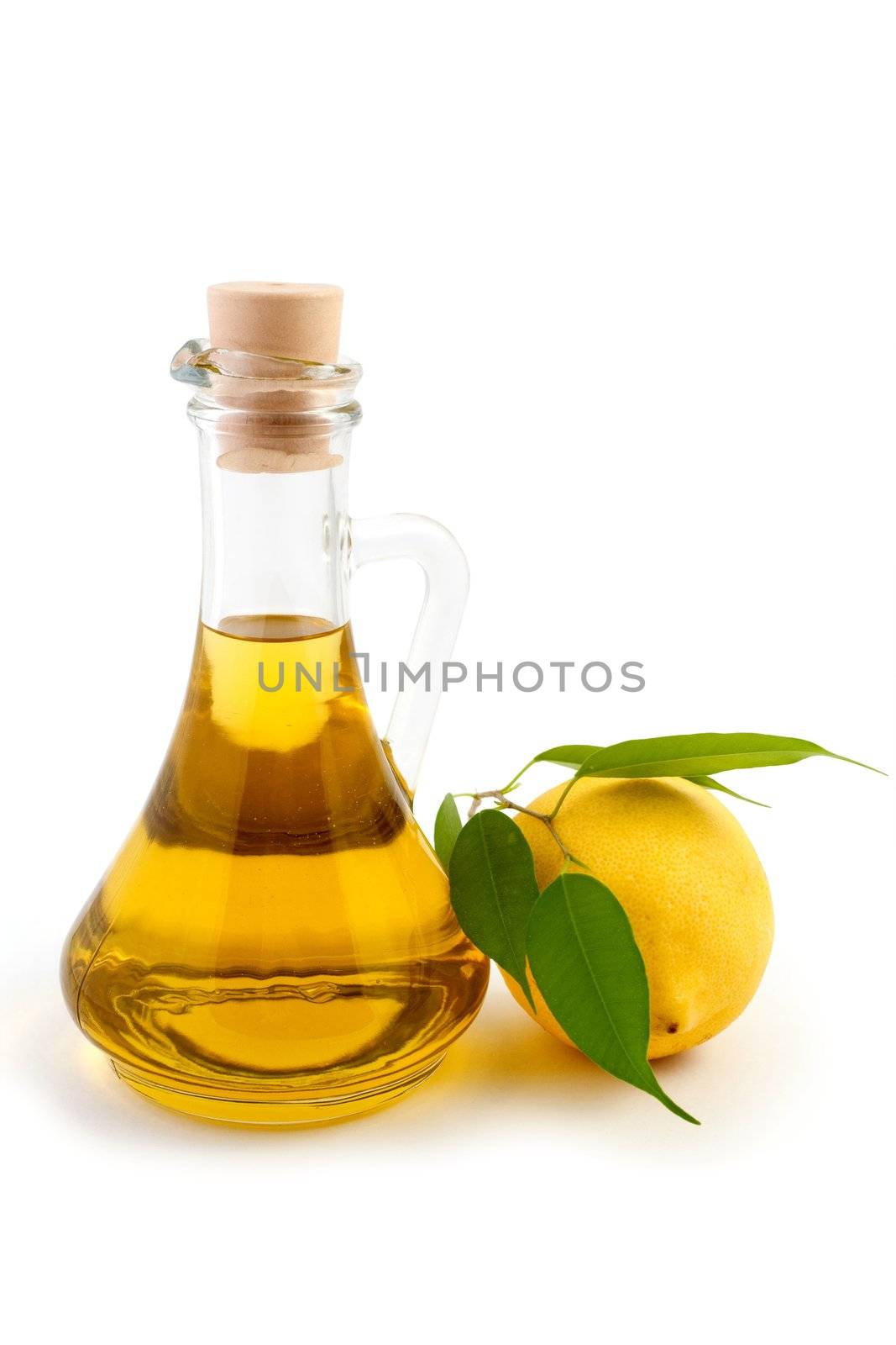 An image of a bottle of olive oil and lemon