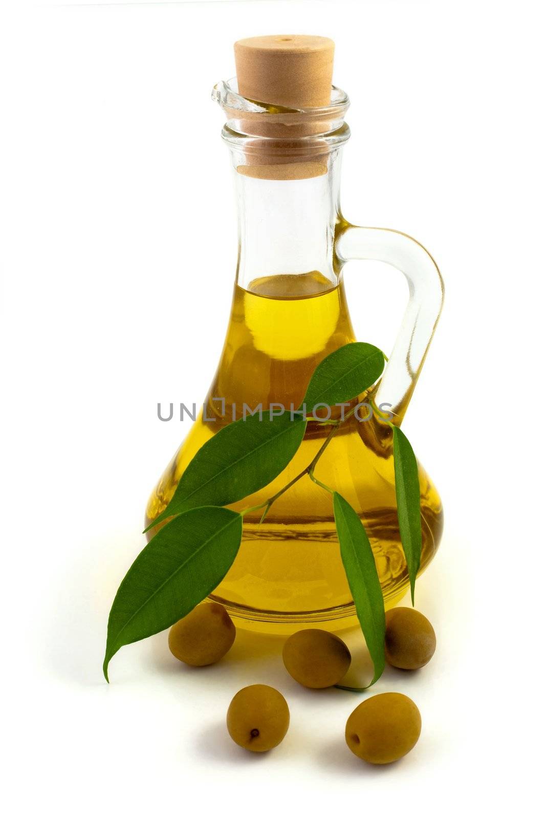 An image of a bottle of olive oil and olives