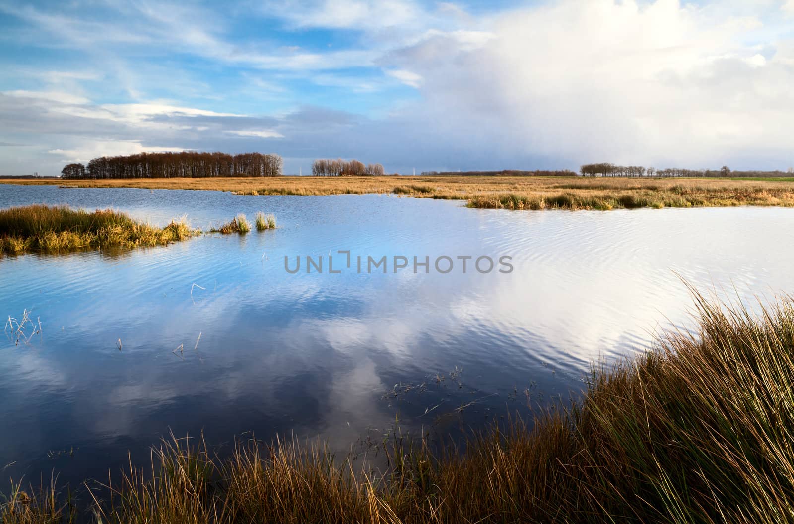 landscape with lake and cloudy sky by catolla